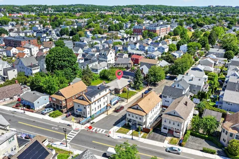 an aerial view of a city with lots of residential buildings