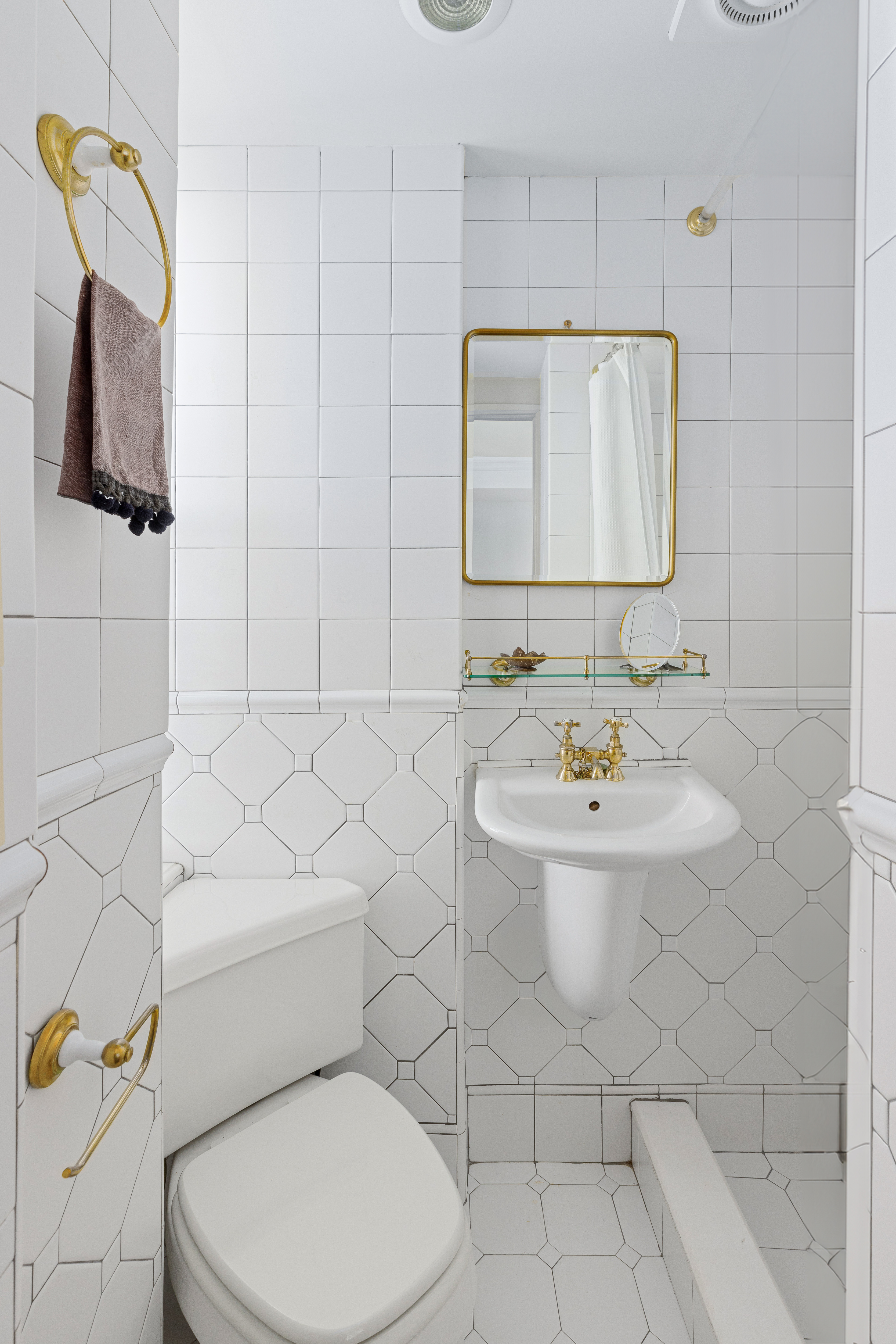 160 Riverside Drive, Unit 12D Manhattan, NY 10024 - Photo 10 of 14 a bathroom with a sink a toilet and mirror