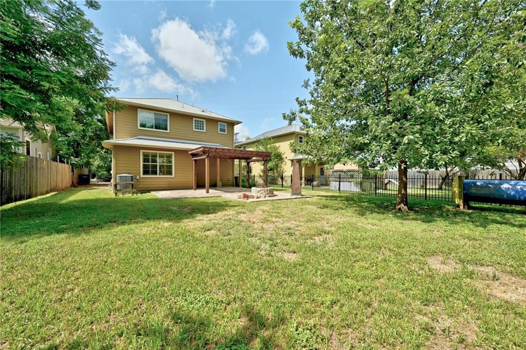1102 Clermont Avenue Austin, TX 78702 - Photo 5 of 30 a front view of a house with a yard