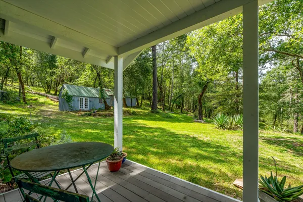 a living room with furniture fireplace and a large window