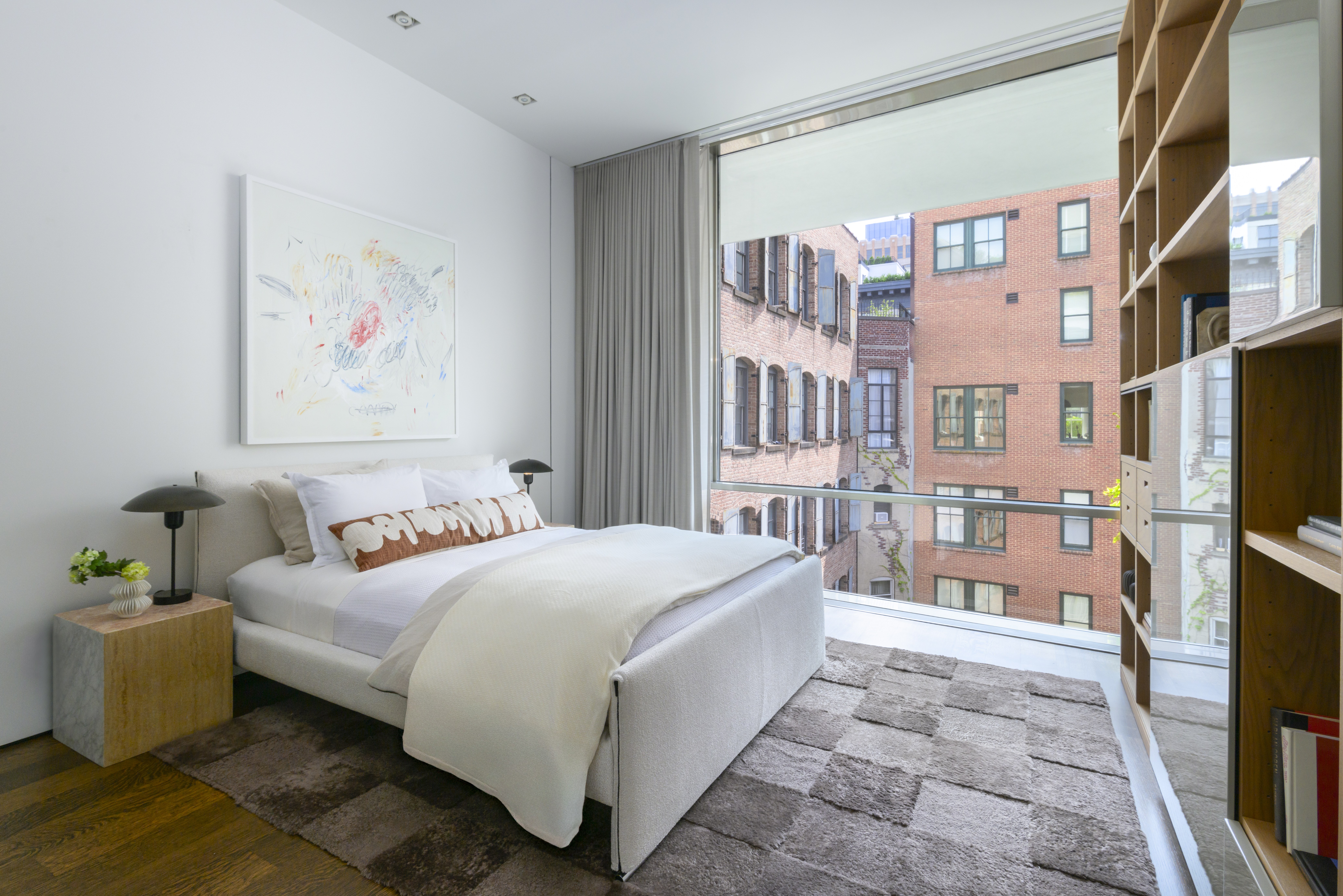 33 Vestry Street Manhattan, NY 10013 - Photo 10 of 16 a bedroom with a bed furniture and a flat screen tv