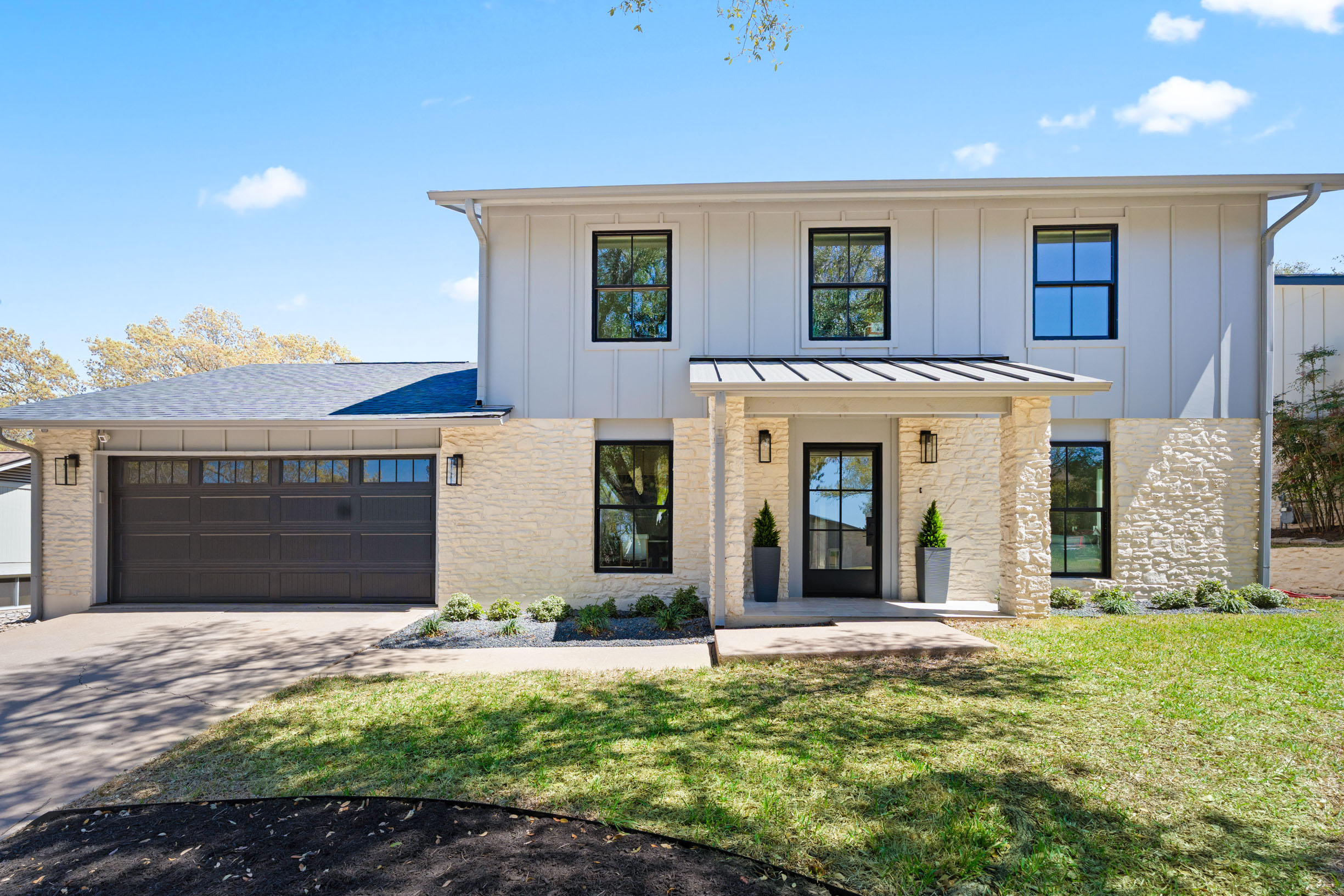 1317 Thaddeus Cove Austin, TX 78746 - Photo 22 of 22 a view of a house with yard and plants
