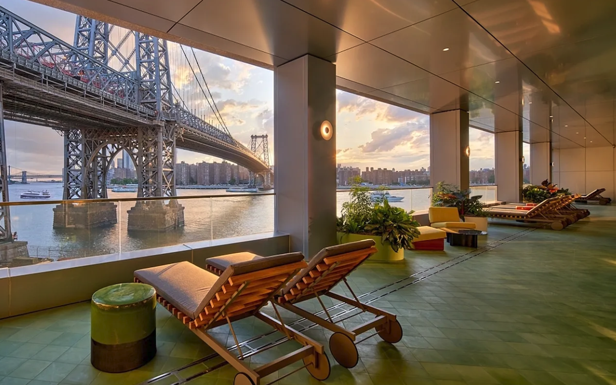 5 South 5th Street, Unit 913 Brooklyn, NY 11249 - Photo 10 of 24 a living room with patio furniture and a floor to ceiling window