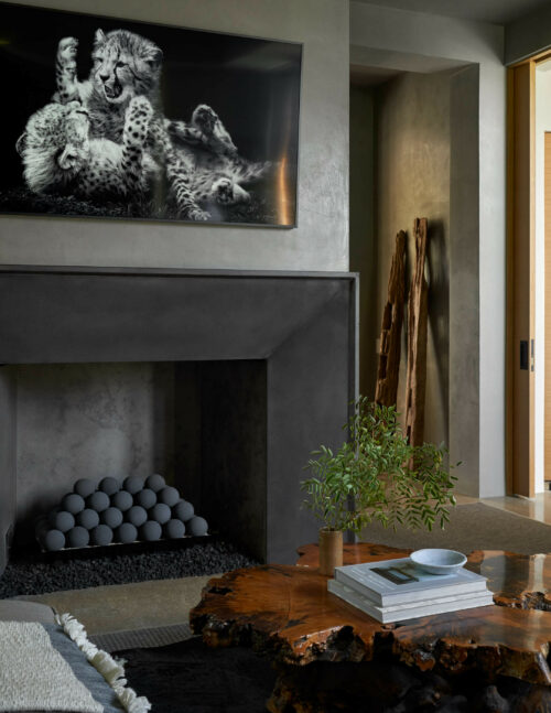 5716 Stonegate Road Dallas, TX 75209 - Photo 17 of 25 a table with a vase of flowers and a wooden floor