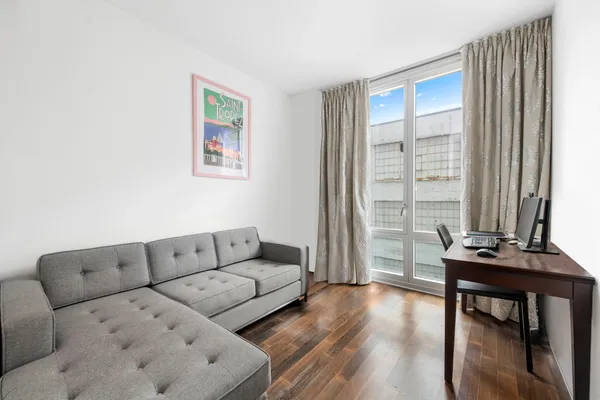 a living room with furniture and a window