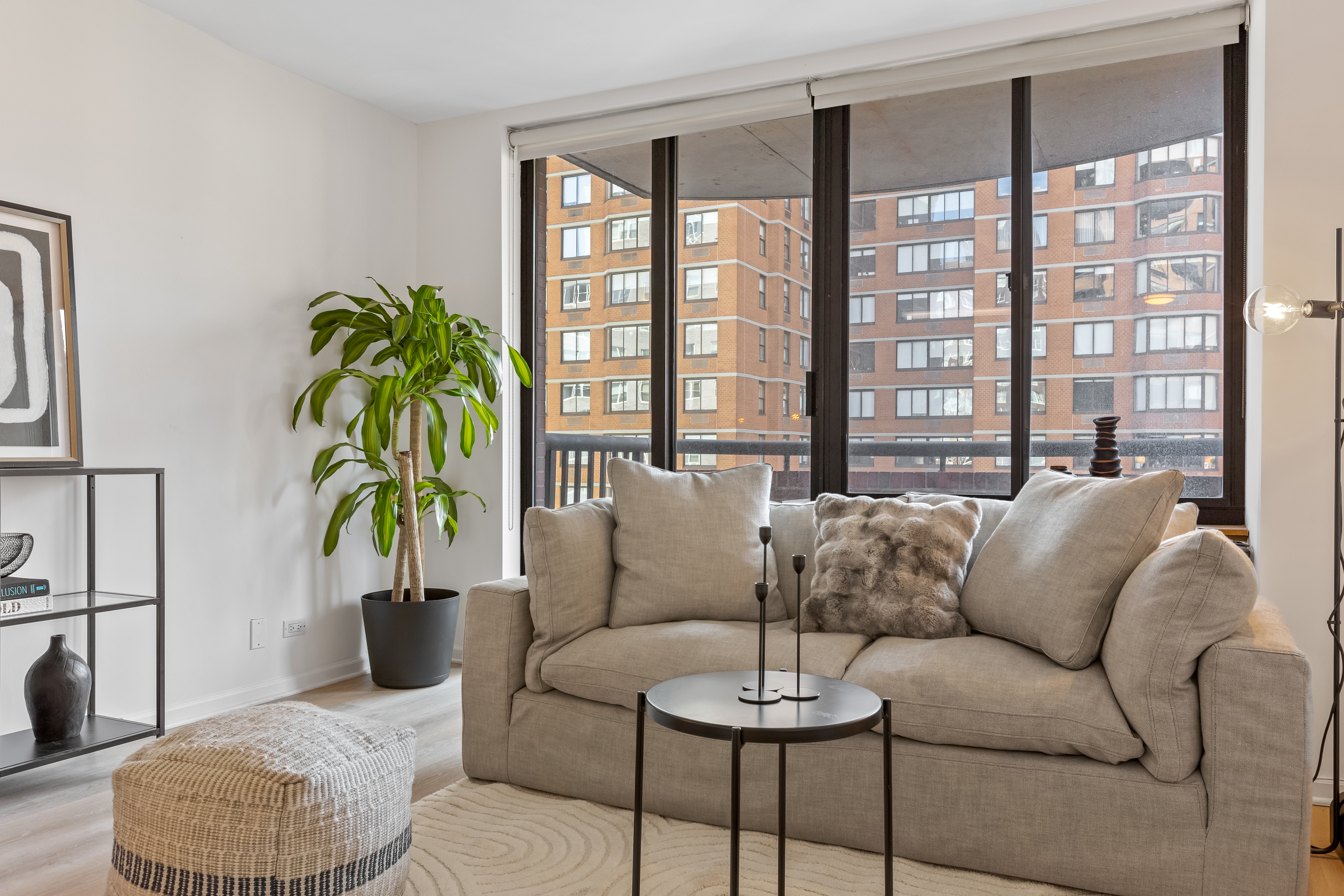 157 East 32nd Street, Unit 8A Manhattan, NY 10016 - Photo 4 of 16 a living room with furniture and a potted plant