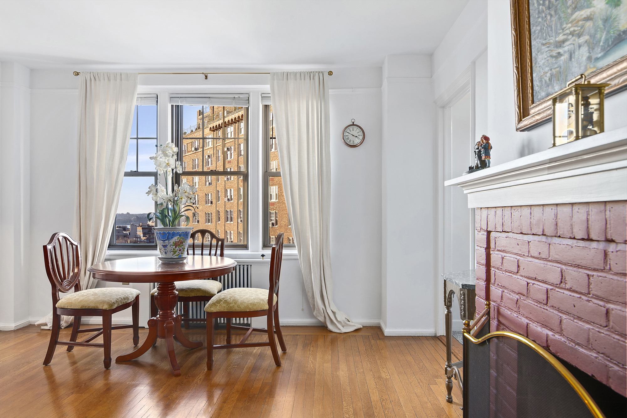 302 West 12th Street, Unit 12C Manhattan, NY 10014 - Photo 2 of 13 a living room with furniture and a window