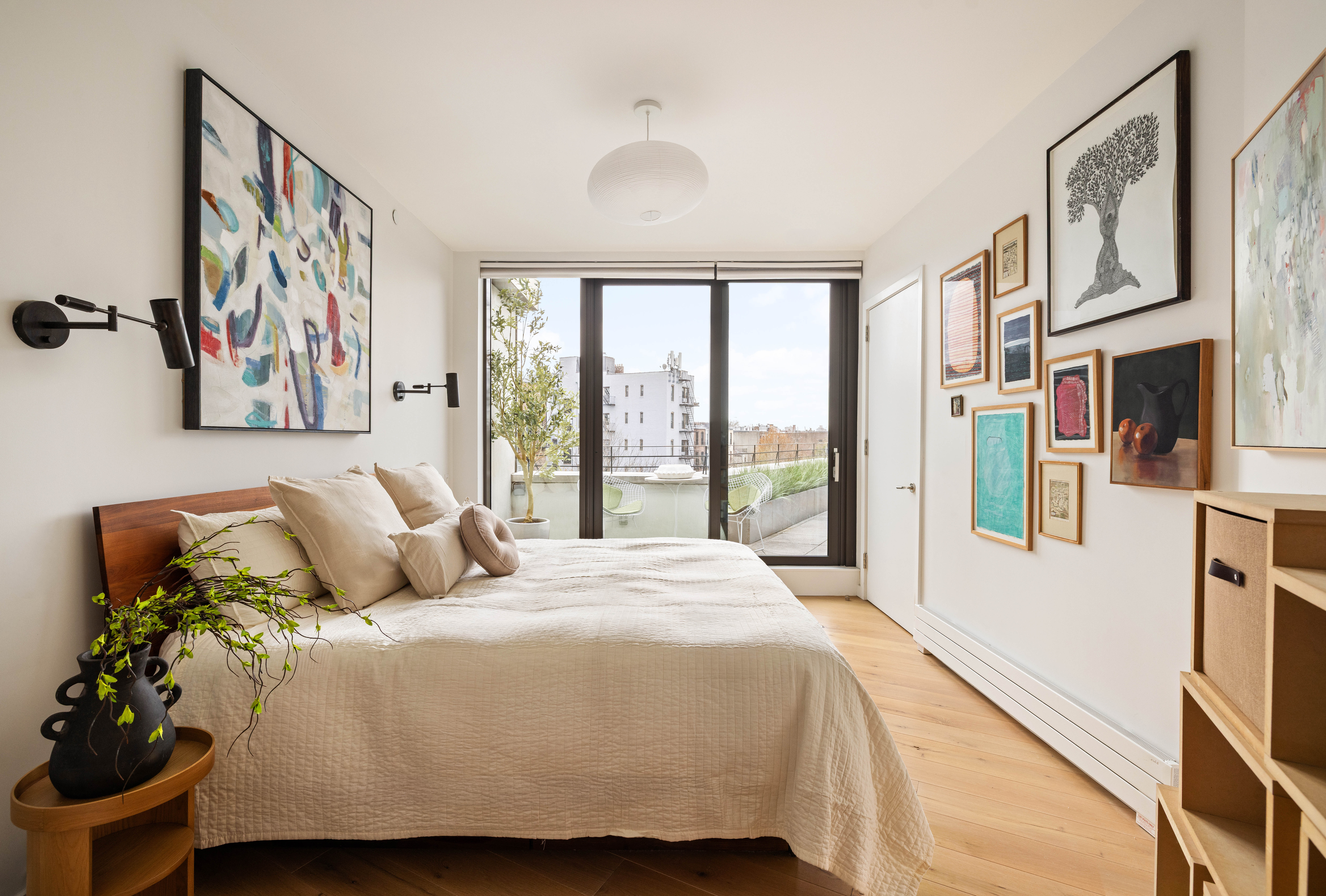 280 Saint Marks Avenue, Unit PHG Brooklyn, NY 11238 - Photo 8 of 14 a bedroom with a balcony a bed and a large window