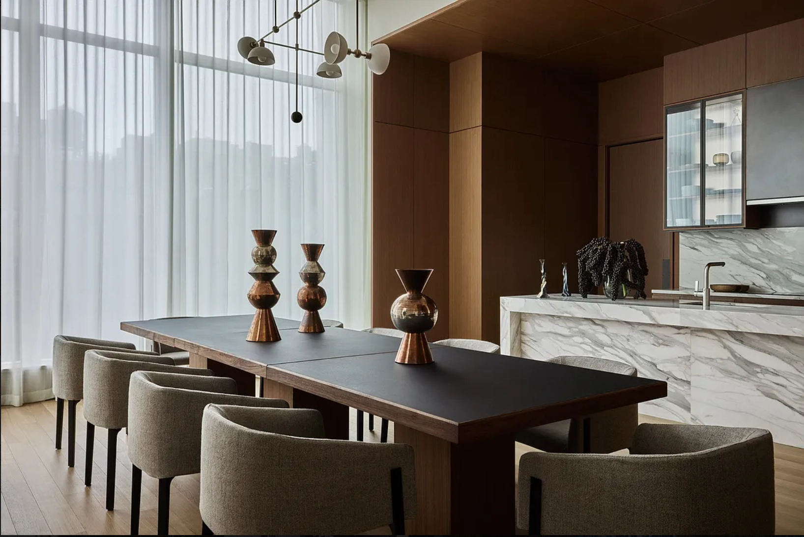 15 East 30th Street, Unit 19B Manhattan, NY 10016 - Photo 33 of 40 a kitchen with a table chairs and a sink
