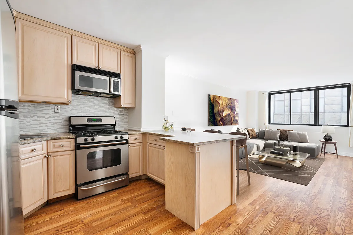 a kitchen with a sink stove and microwave