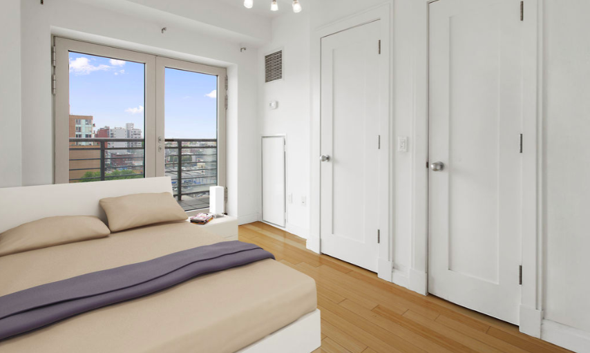 302 2nd Street, Unit 9L Brooklyn, NY 11215 - Photo 2 of 9 a bedroom with furniture and a window