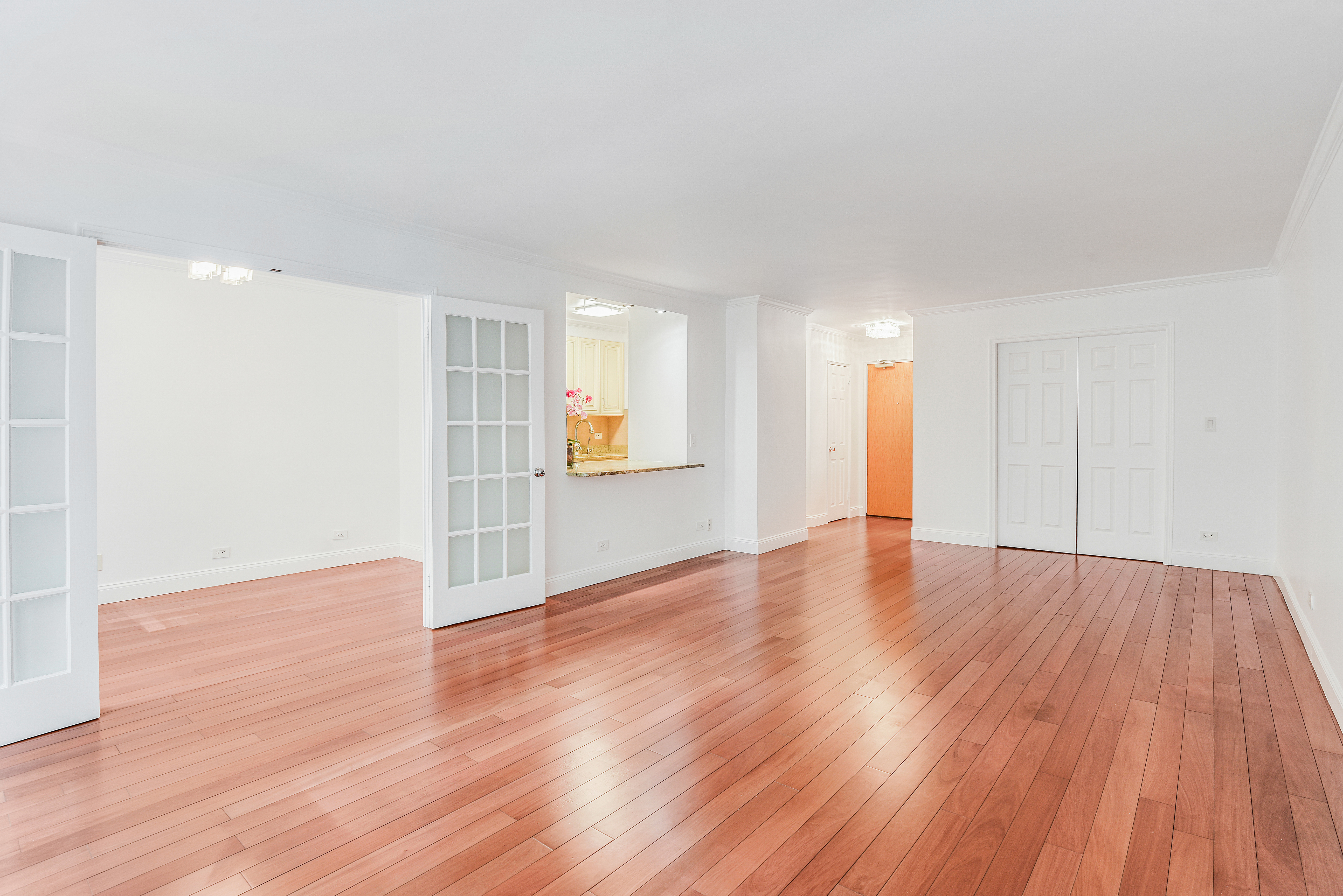 200 Central Park South, Unit 5M Manhattan, NY 10019 - Photo 8 of 15 a view of an empty room with wooden floor and a window