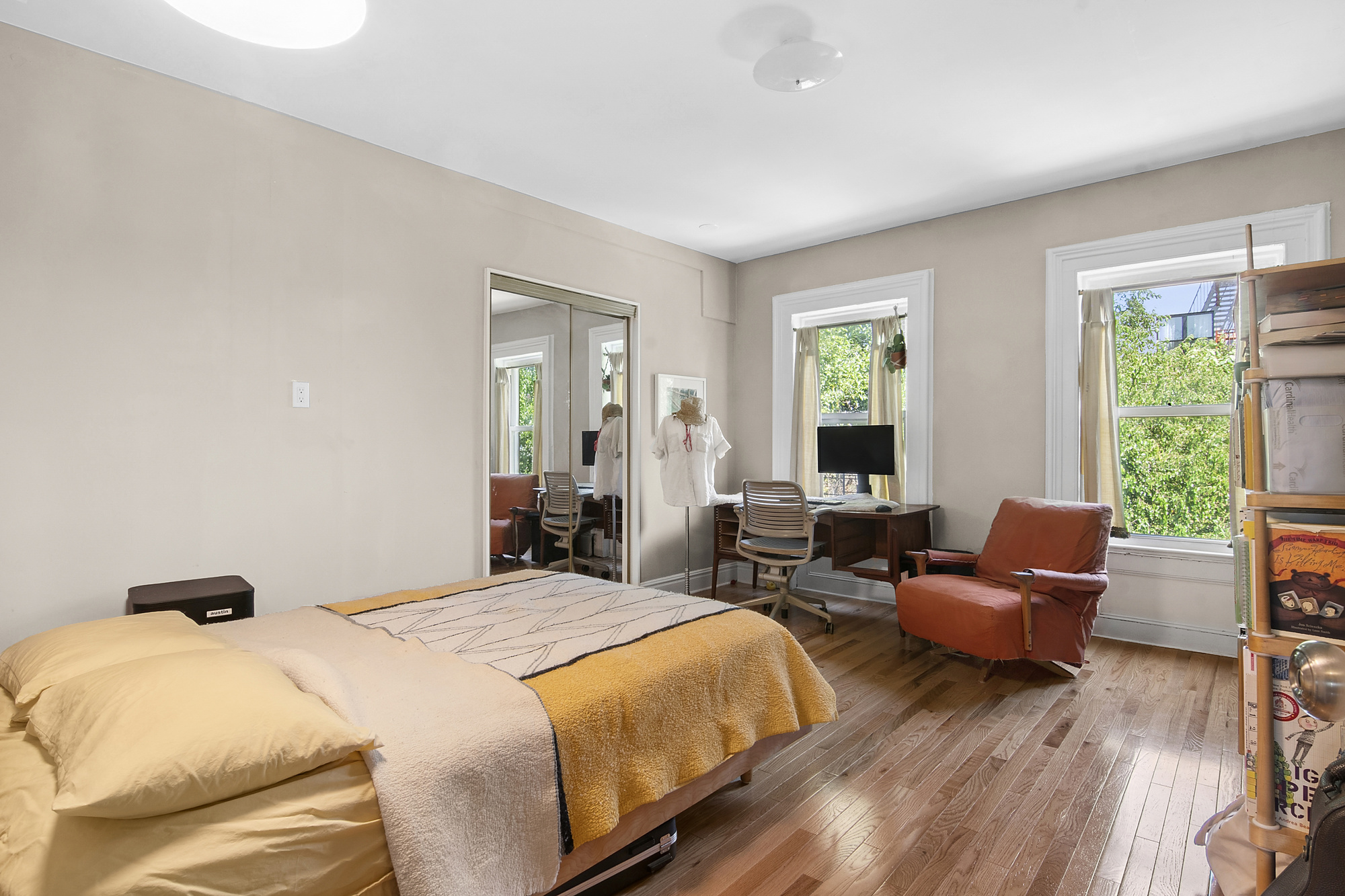 789 A Monroe Street, Unit 2 Brooklyn, NY 11221 - Photo 4 of 8 a bedroom with a bed and wooden floor