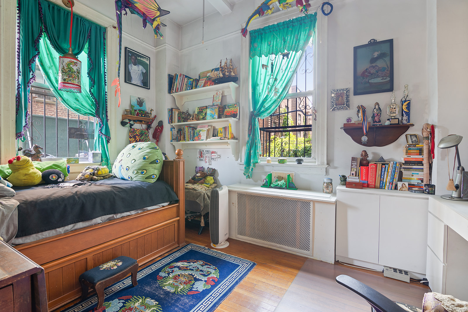 41 Eastern Parkway, Unit 1D Brooklyn, NY 11238 - Photo 12 of 16 a living room with furniture and a bookshelf