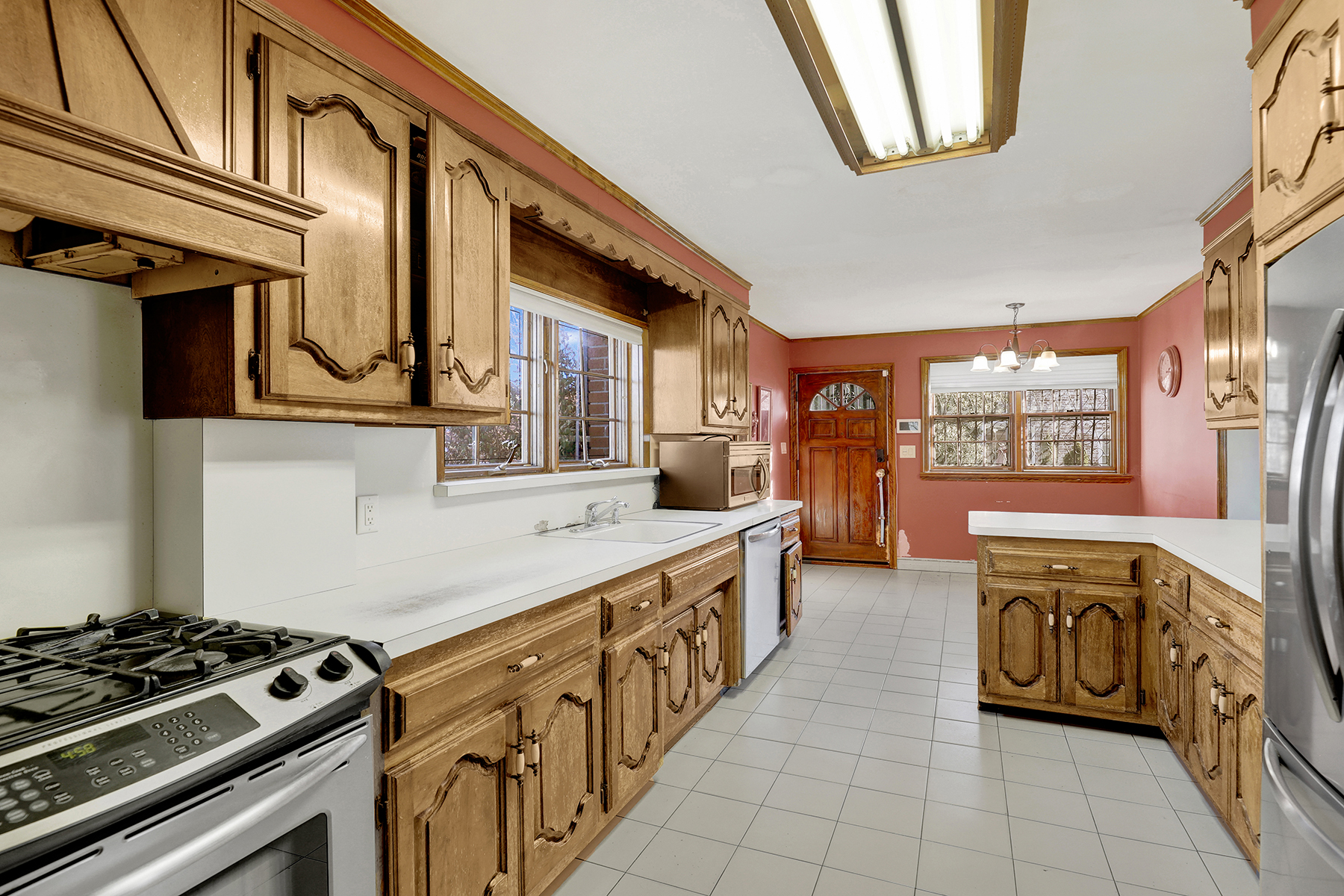 142-15 Newport Avenue Queens, NY 11694 - Photo 23 of 72 a kitchen with stainless steel appliances granite countertop a stove and a sink