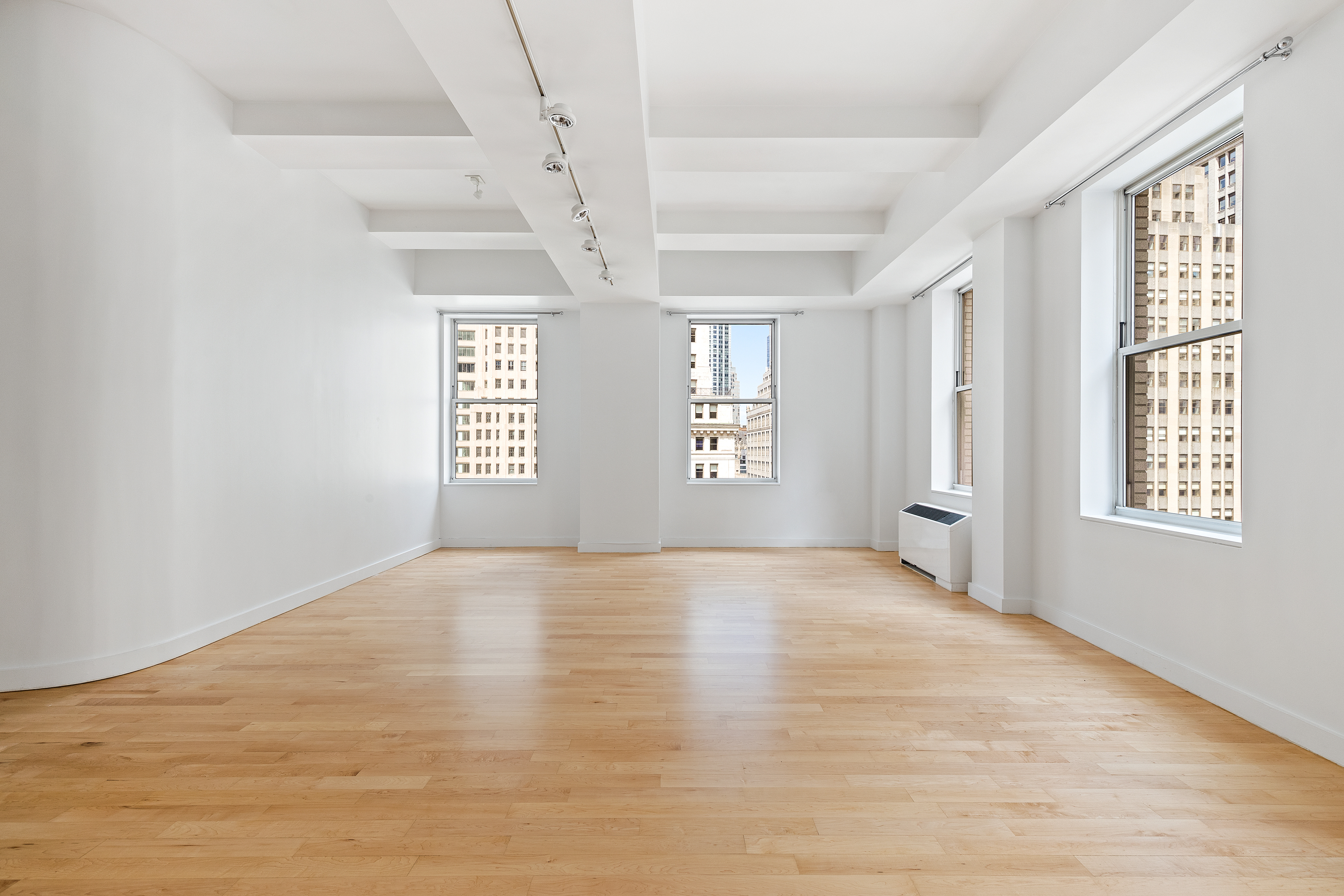 15 Broad Street, Unit 2000 Manhattan, NY 10005 - Photo 2 of 6 a view of an empty room with a window