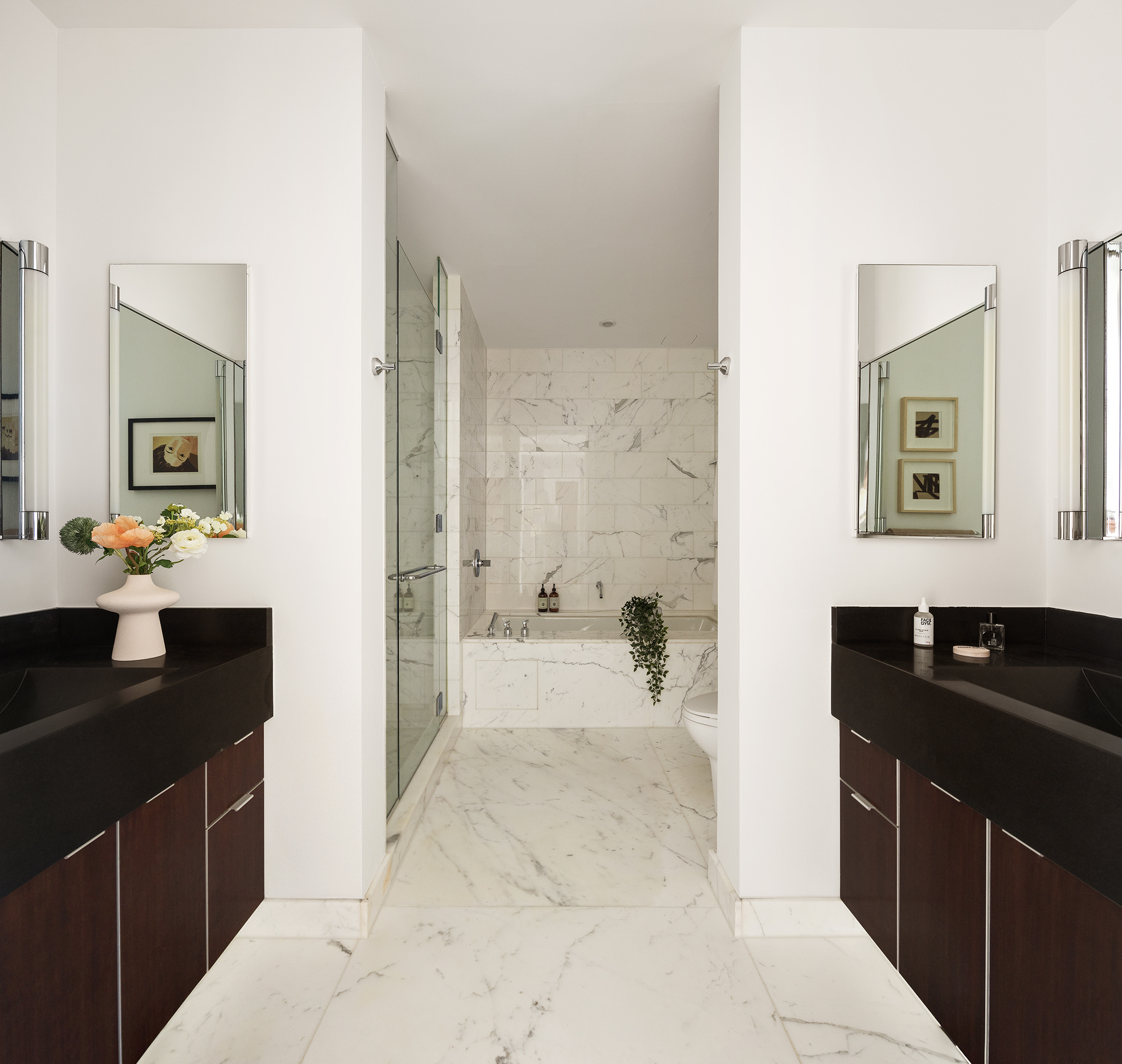 445 Lafayette Street, Unit 9C Manhattan, NY 10003 - Photo 6 of 10 a bathroom with a sink a tub and a mirror