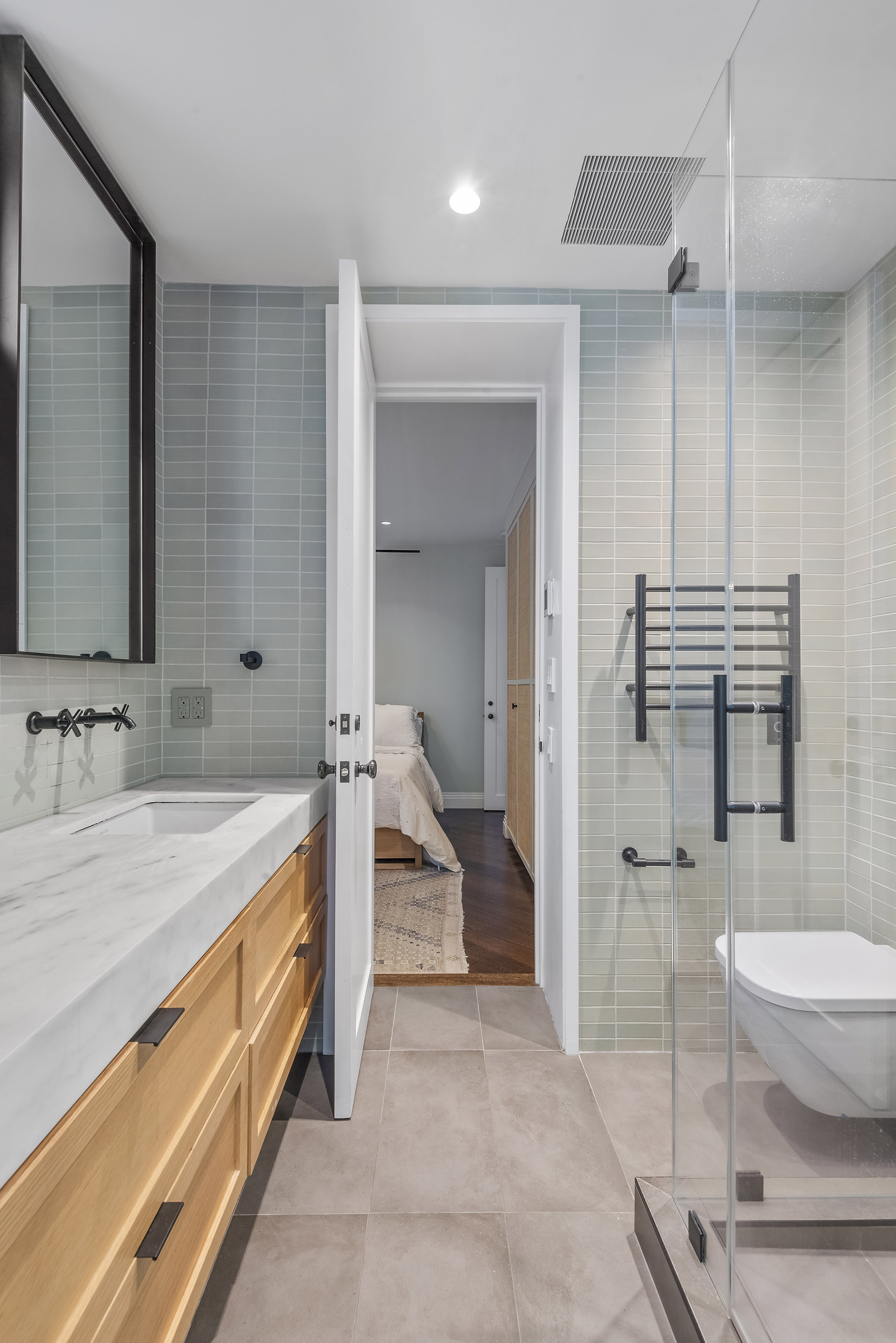 9 Garden Place, Unit 2 Brooklyn, NY 11201 - Photo 12 of 18 a spacious bathroom with a granite countertop sink and a mirror