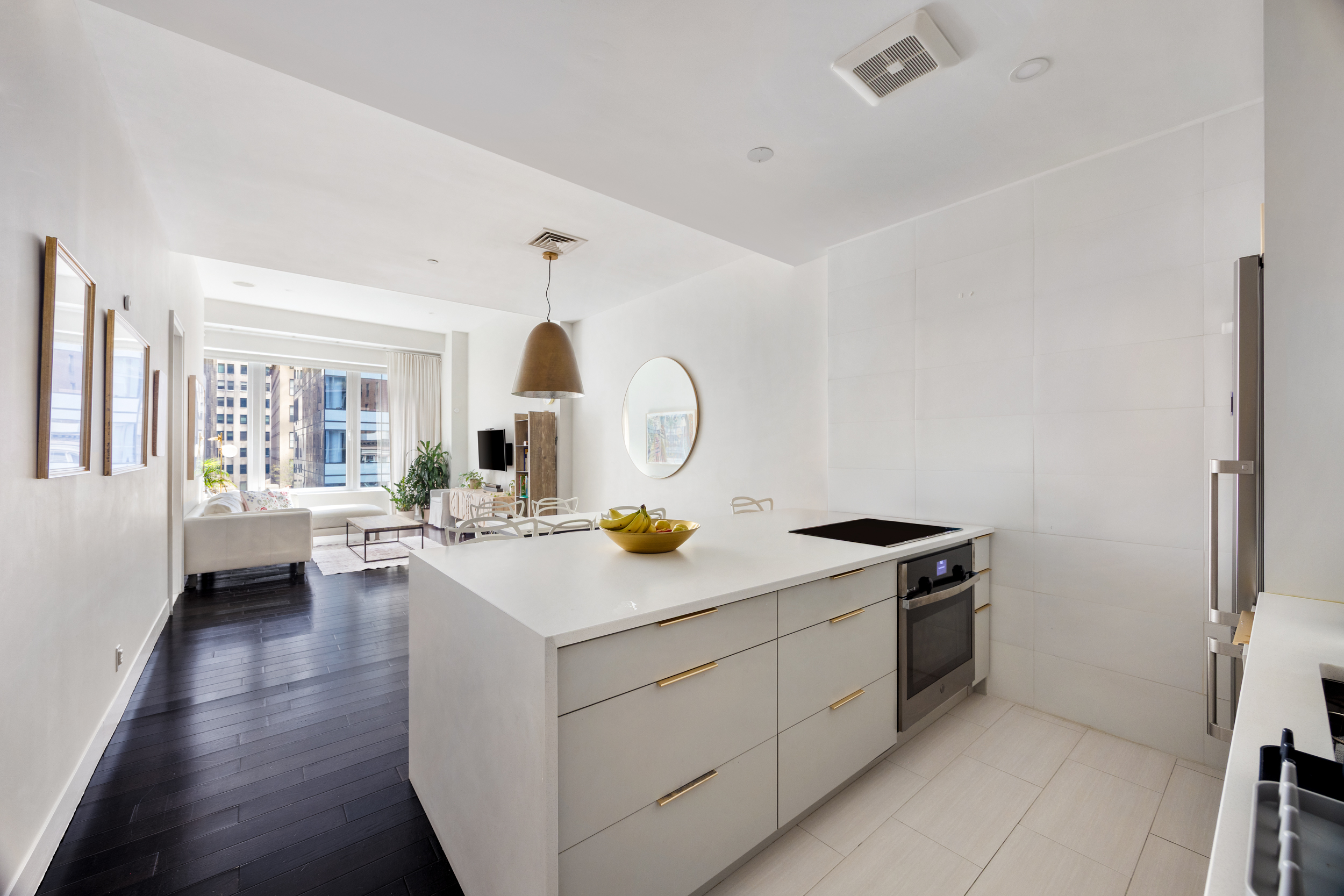111 Fulton Street, Unit 824 Manhattan, NY 10038 - Photo 5 of 35 a kitchen with a sink stove and cabinets