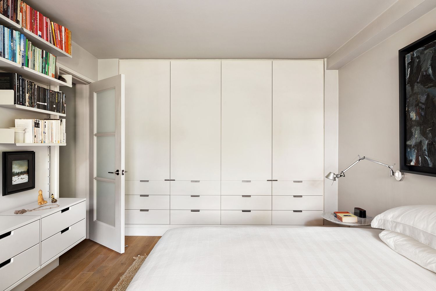 a view of a bedroom with furniture and natural light