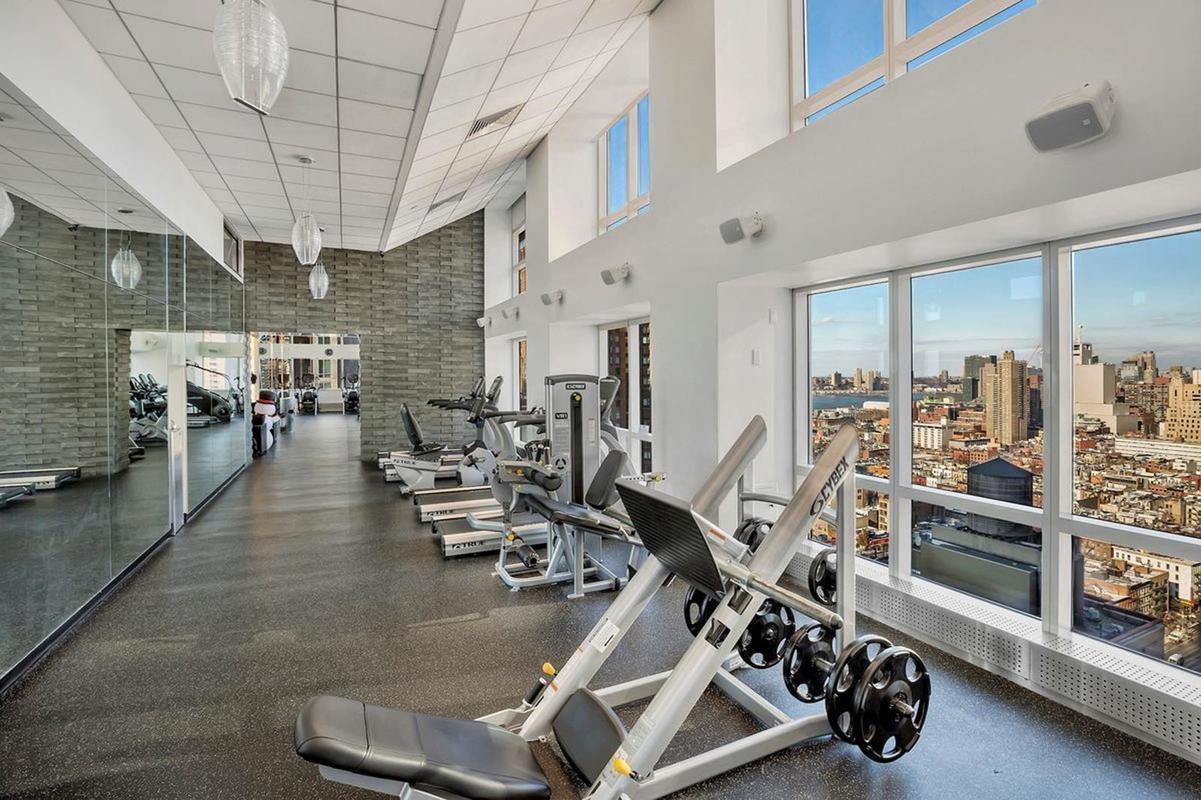 350 West 42nd Street, Unit 20G Manhattan, NY 10036 - Photo 18 of 27 a view of a room with gym equipment