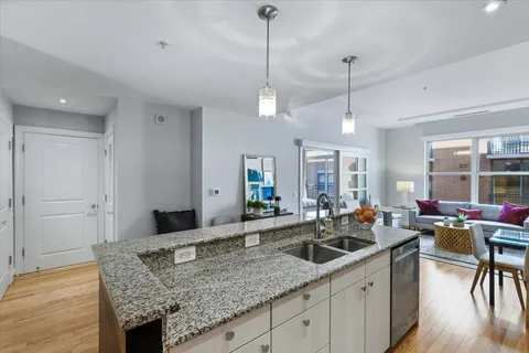 a view of a kitchen counter space dining table and chairs