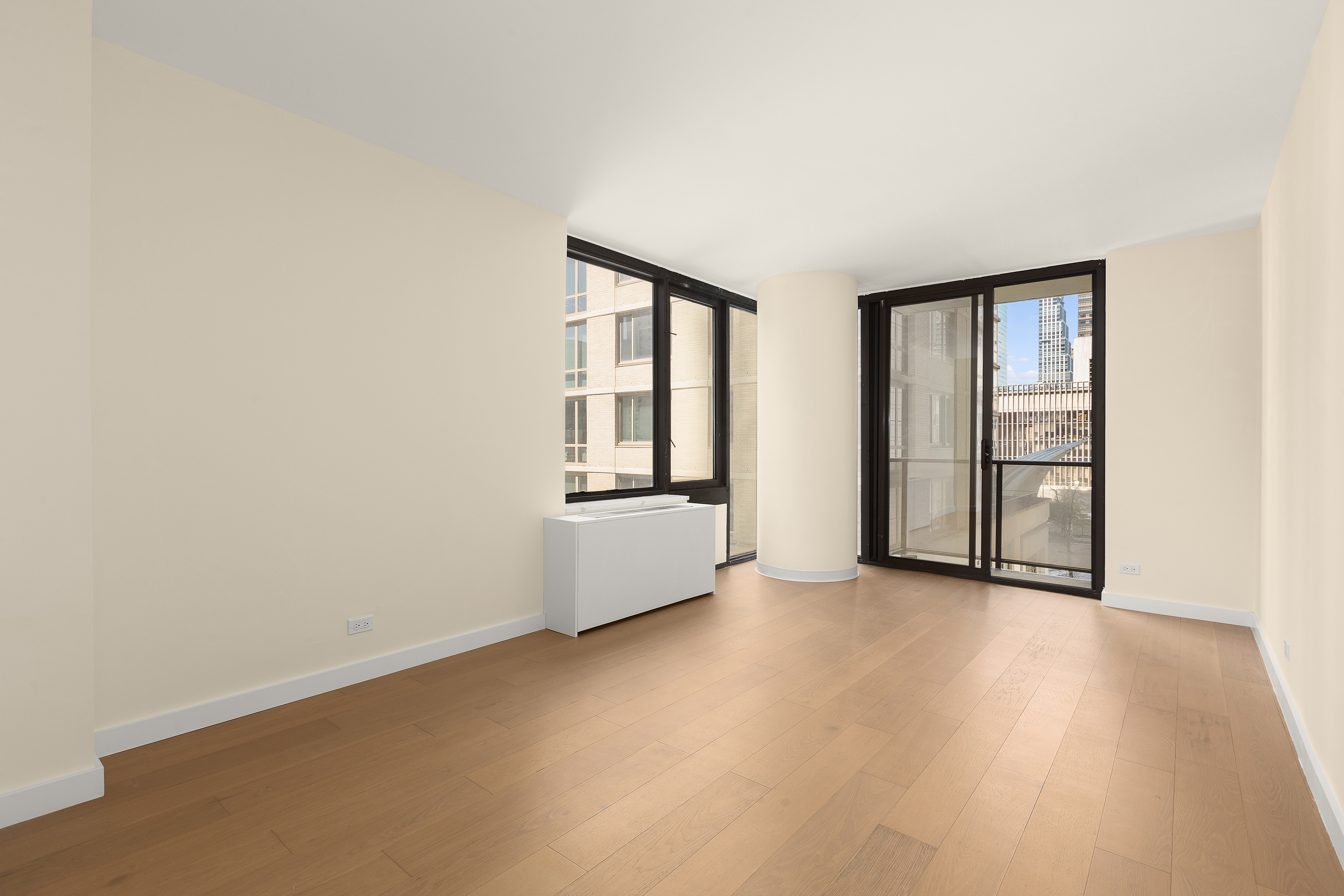 161 West 61st Street, Unit 5C Manhattan, NY 10023 - Photo 15 of 30 an empty room with windows and closet