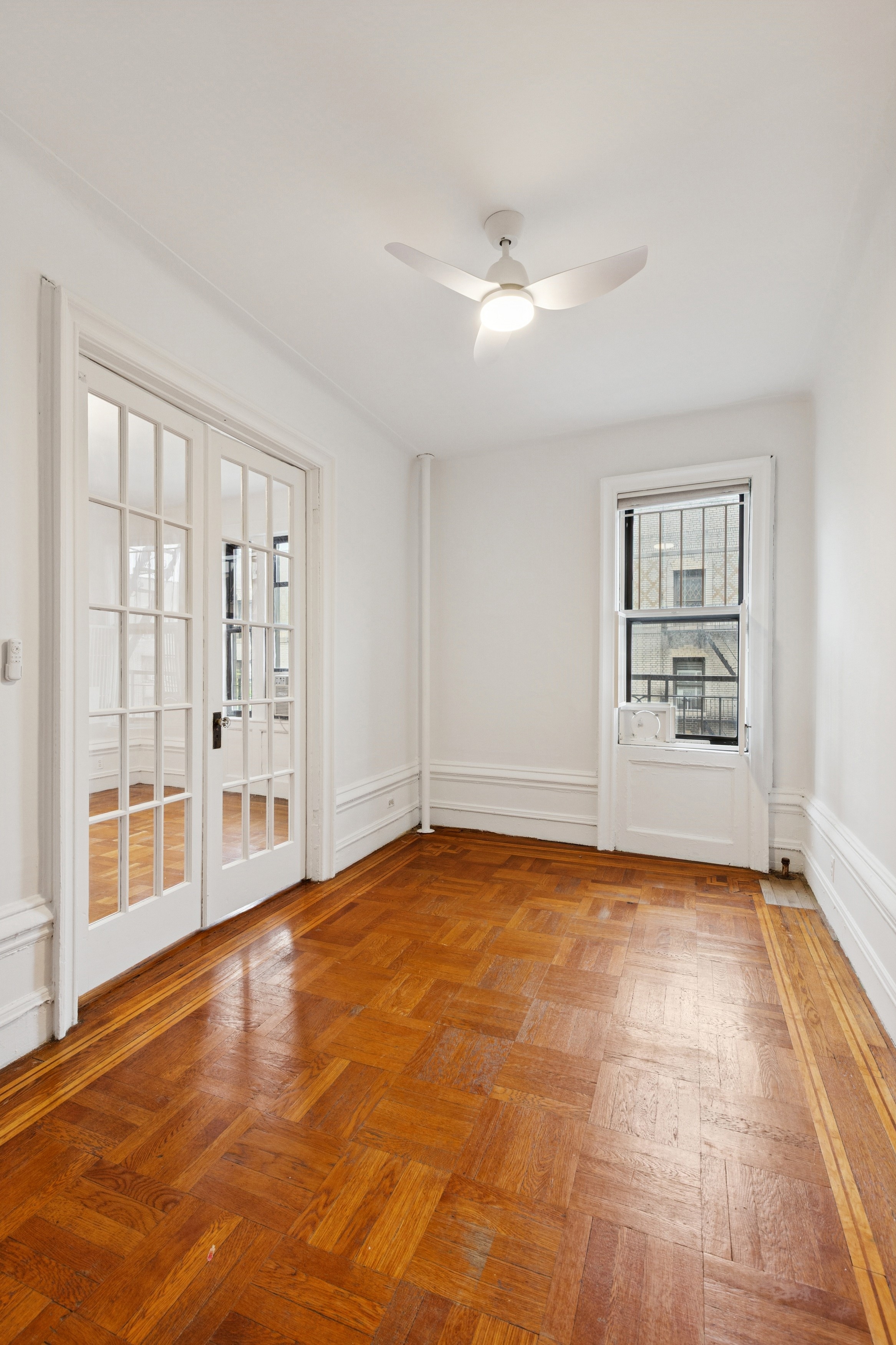 804 West 180th Street, Unit 41 Manhattan, NY 10033 - Photo 5 of 23 a view of an empty room with a window