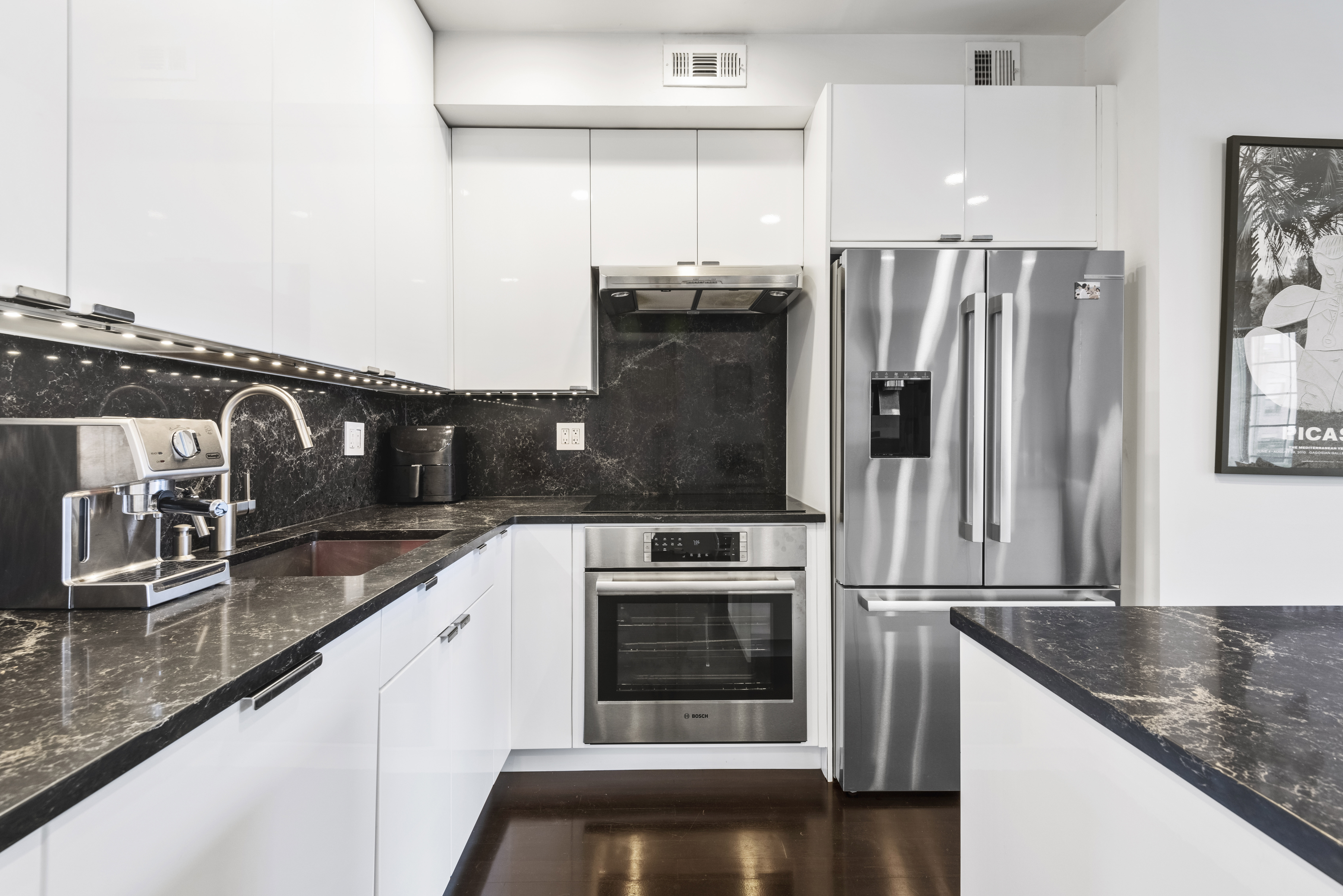 347 3rd Street, Unit C4A Brooklyn, NY 11215 - Photo 5 of 11 a kitchen with granite countertop a refrigerator and a stove