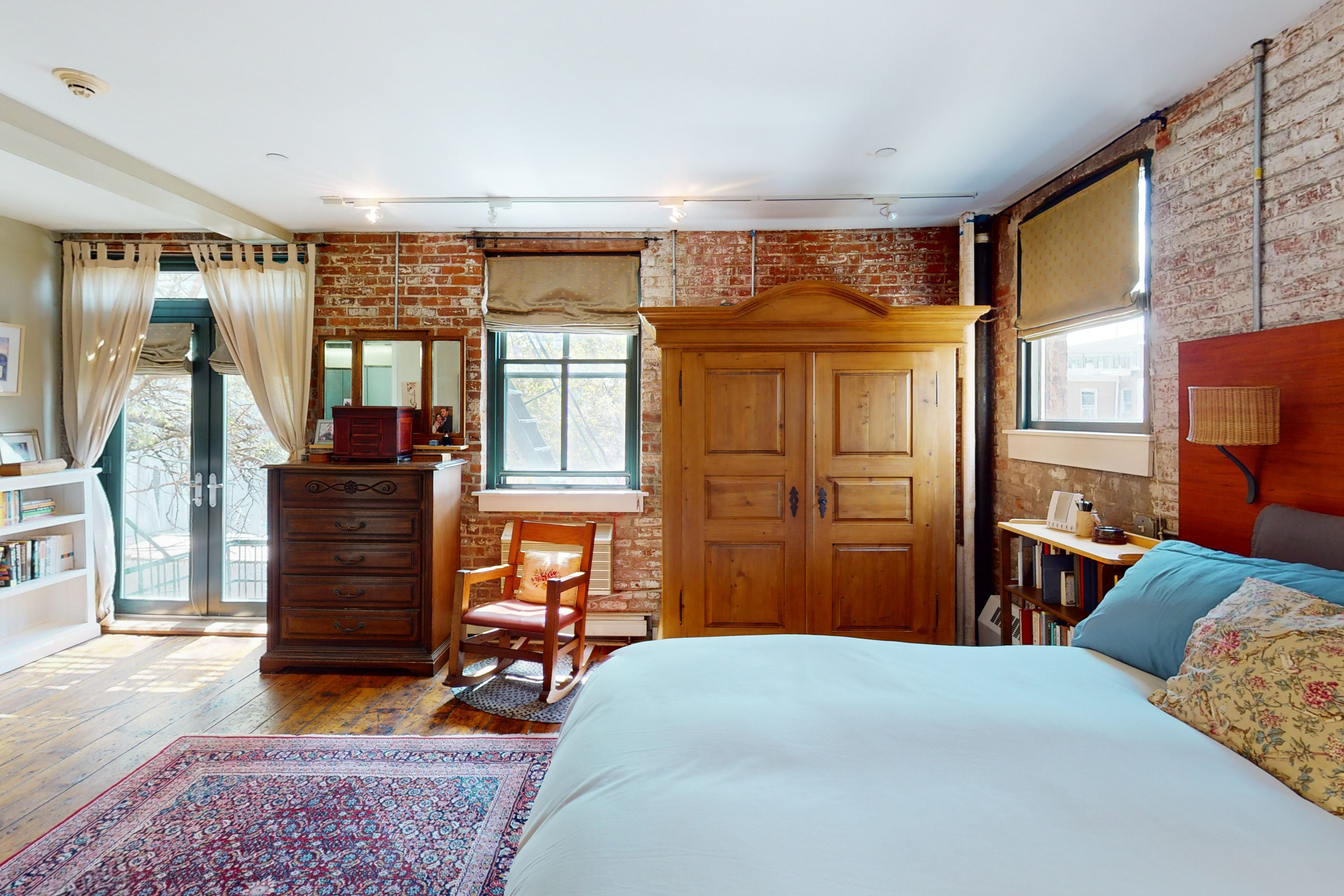 248 17th Street, Unit 6 Brooklyn, NY 11215 - Photo 10 of 21 a bedroom with a bed and wooden floor