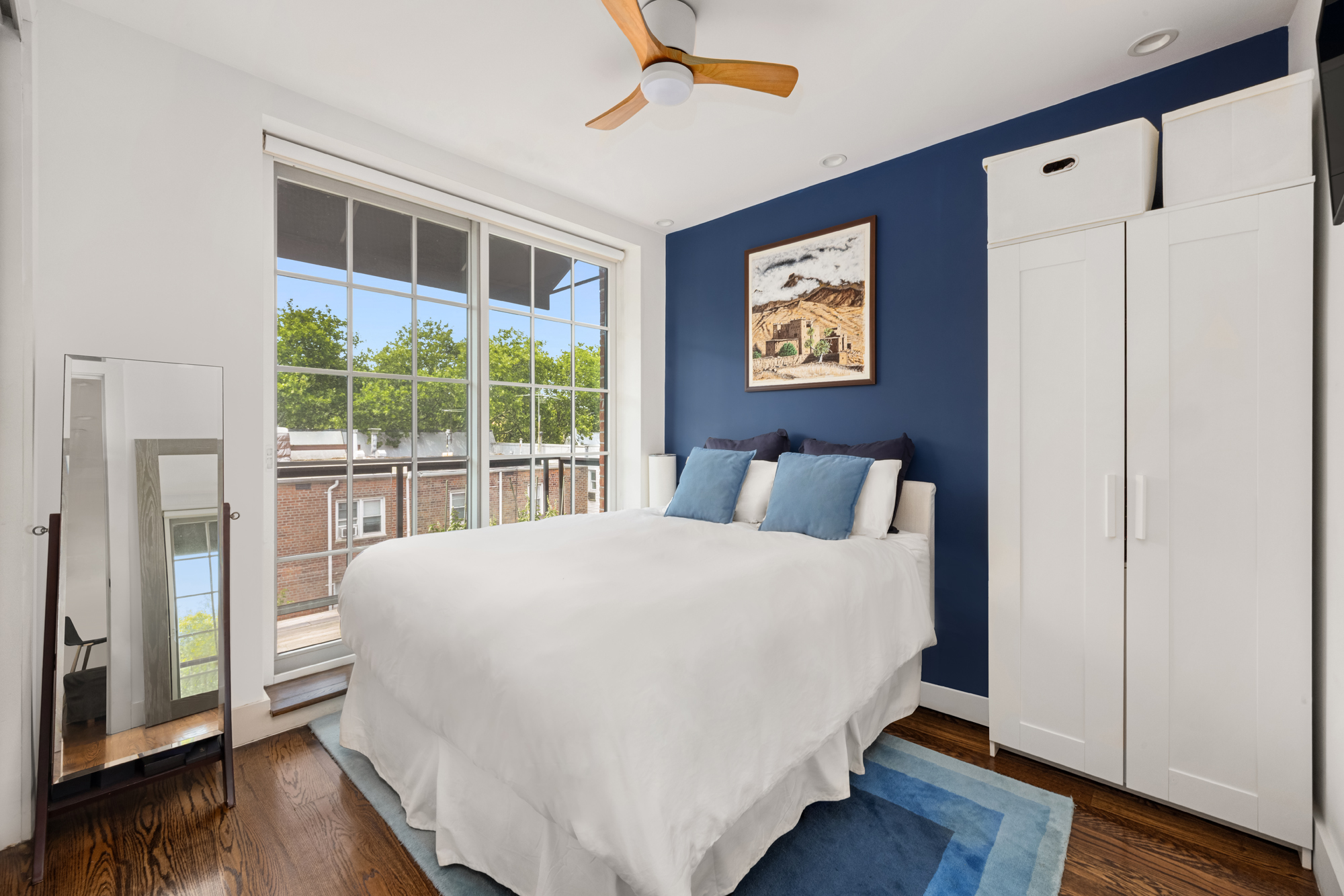 43 Newel Street, Unit PH2 Brooklyn, NY 11222 - Photo 5 of 10 a large bed sitting in a bedroom next to a window