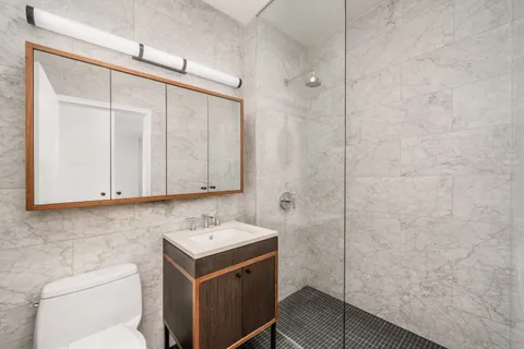 a bathroom with a sink toilet and vanity