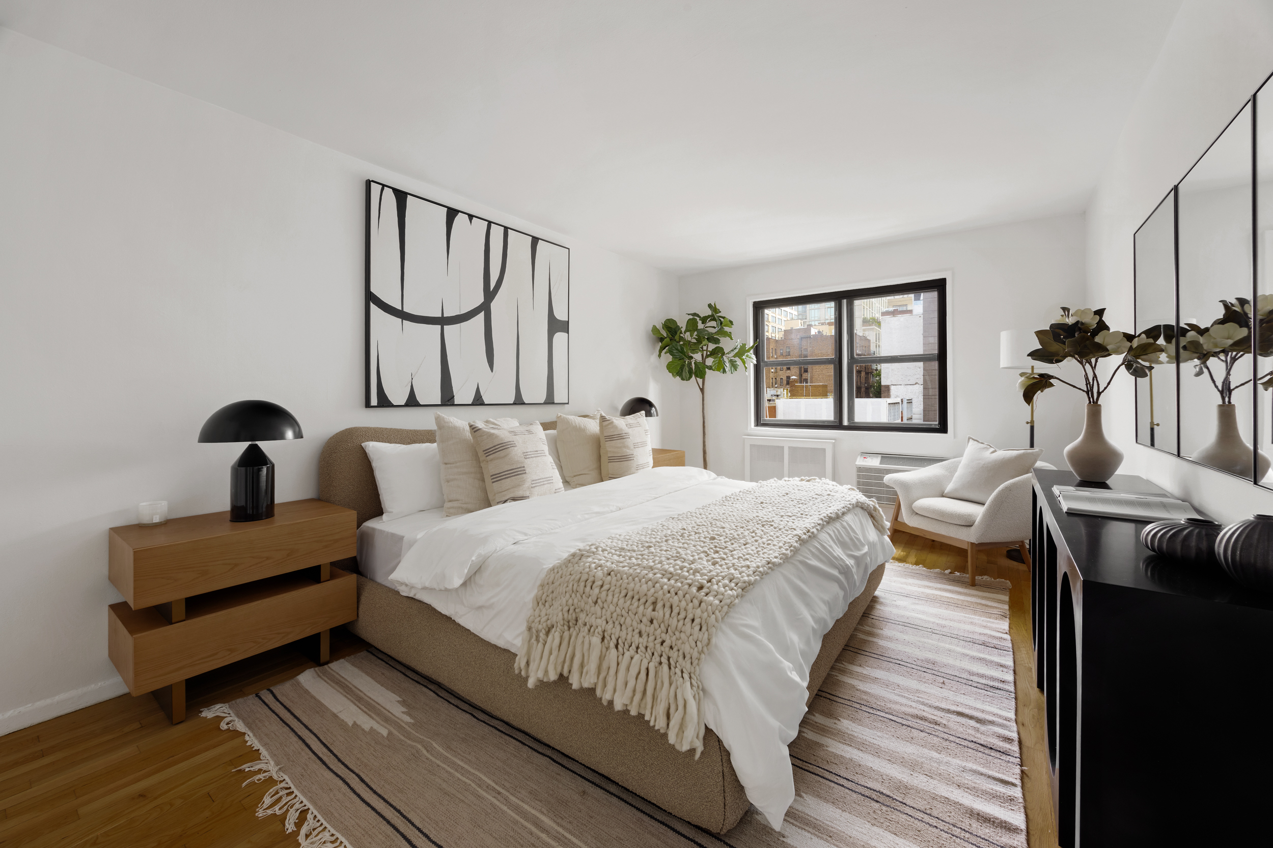 140 7th Avenue, Unit 4L Manhattan, NY 10011 - Photo 10 of 14 a spacious bedroom with bed and a window