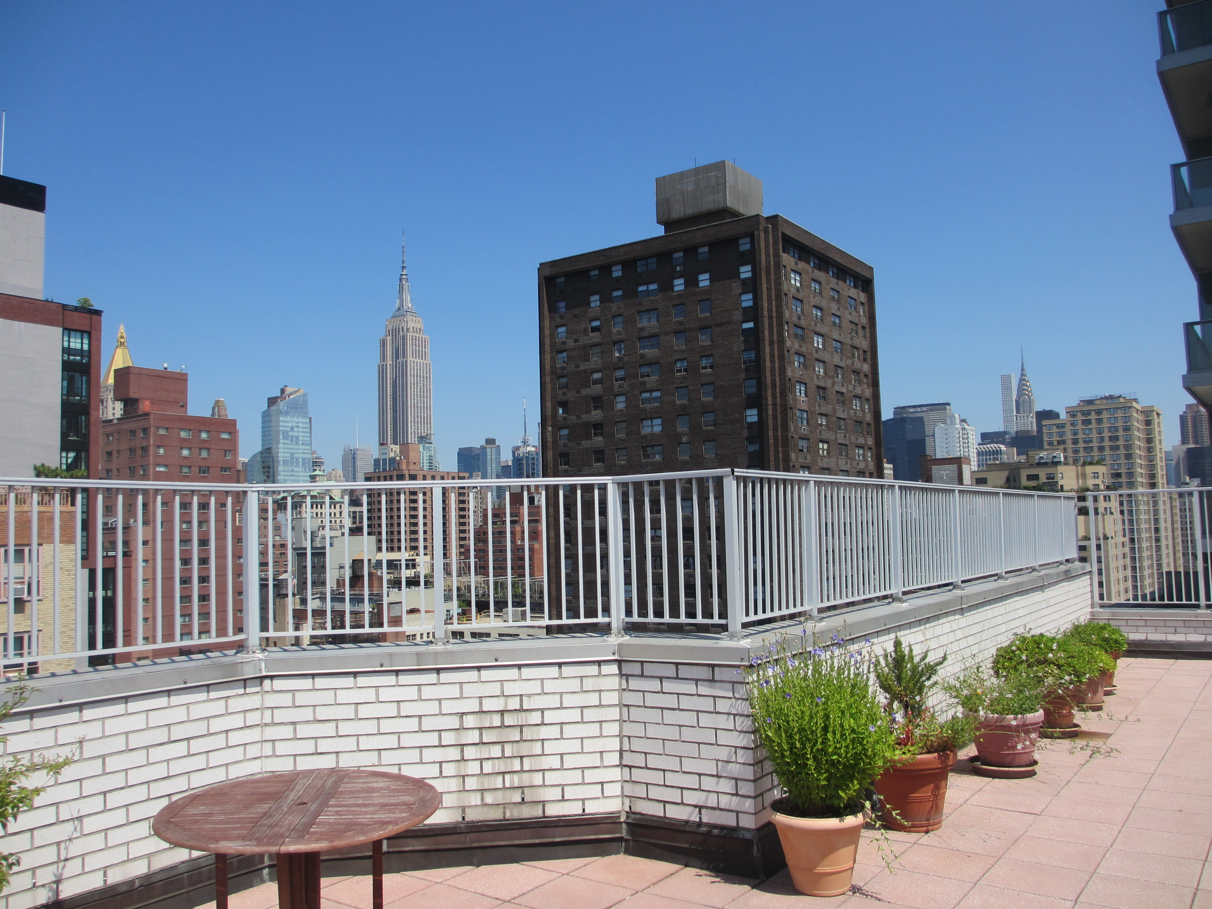 301 East 22nd Street, Unit 5G Manhattan, NY 10010 - Photo 8 of 10 a view of a chairs on the roof deck