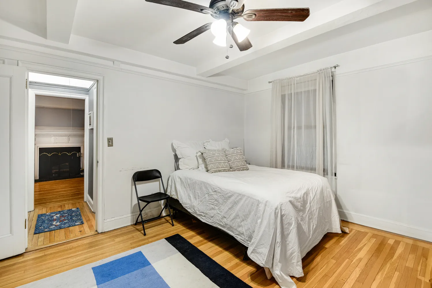 a bedroom with a bed and a walk in closet