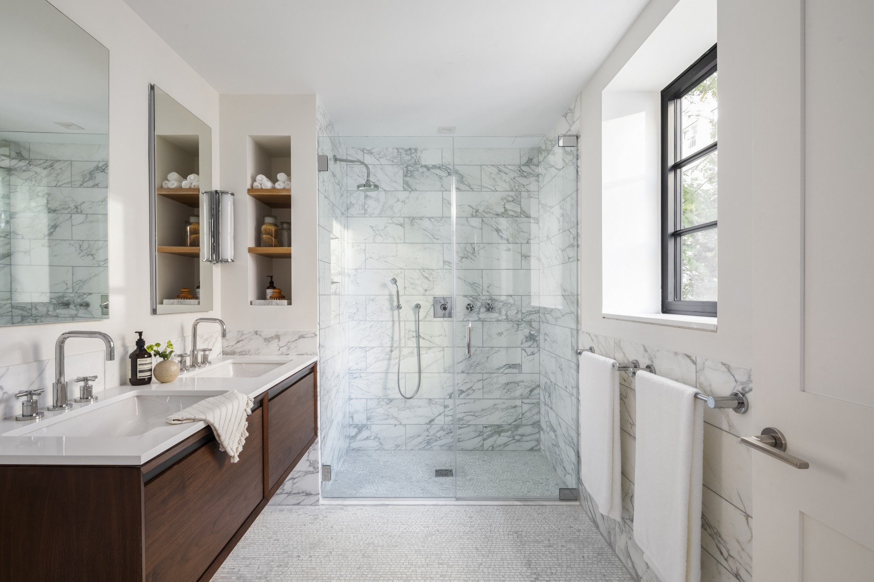 245 East 78th Street, Unit 5A Manhattan, NY 10075 - Photo 7 of 14 a bathroom with a double vanity sink toilet and shower