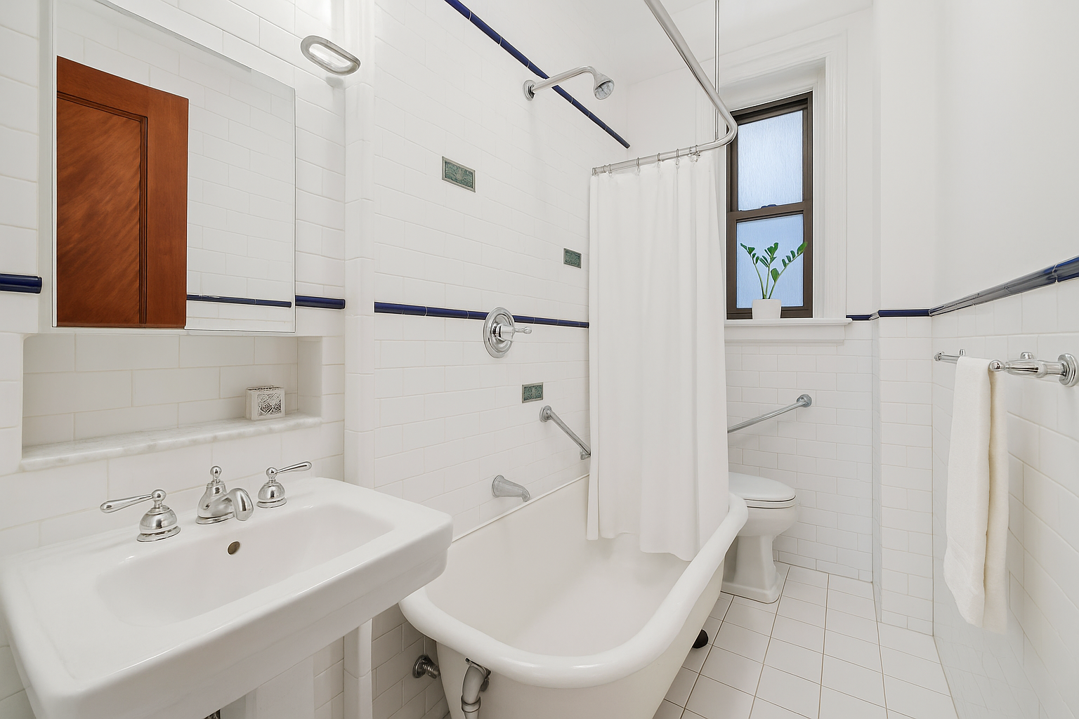 605 West 111th Street, Unit 43 Manhattan, NY 10025 - Photo 19 of 21 a bathroom with a sink a toilet and shower