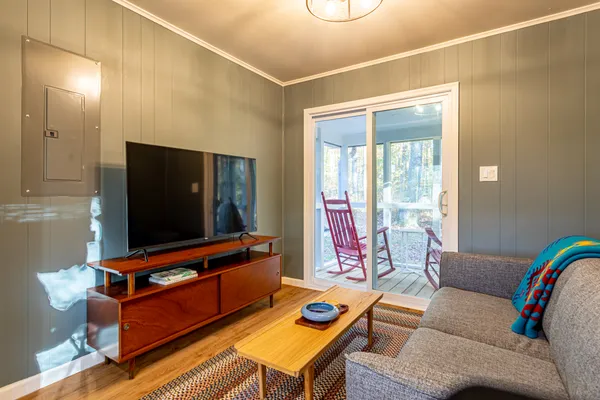 a view of a room with wooden floor and chair