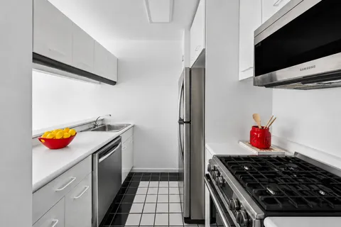 a kitchen with a stove and a microwave