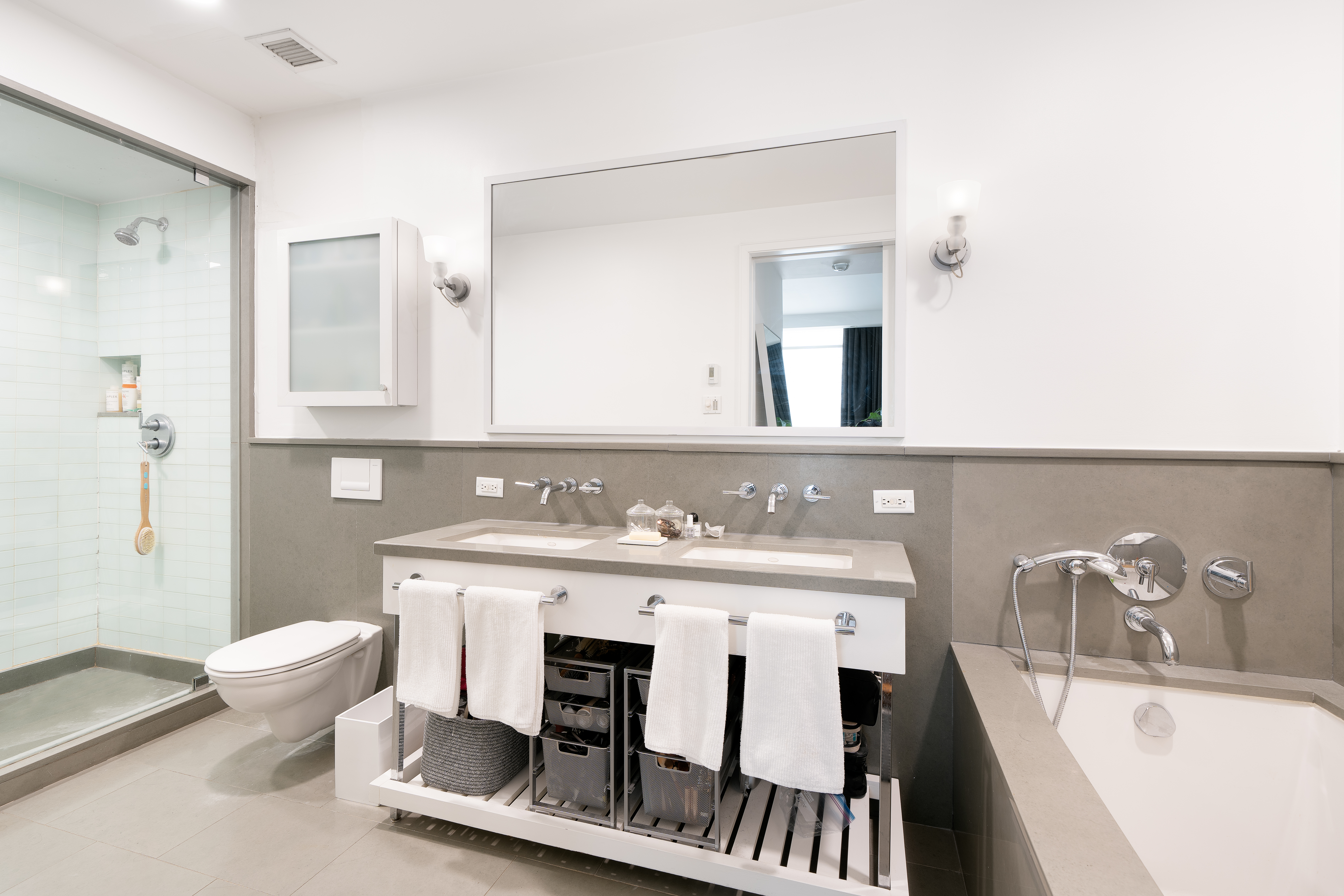 330 Spring Street, Unit 5C Manhattan, NY 10013 - Photo 6 of 18 a bathroom with a sink a toilet and a bathtub