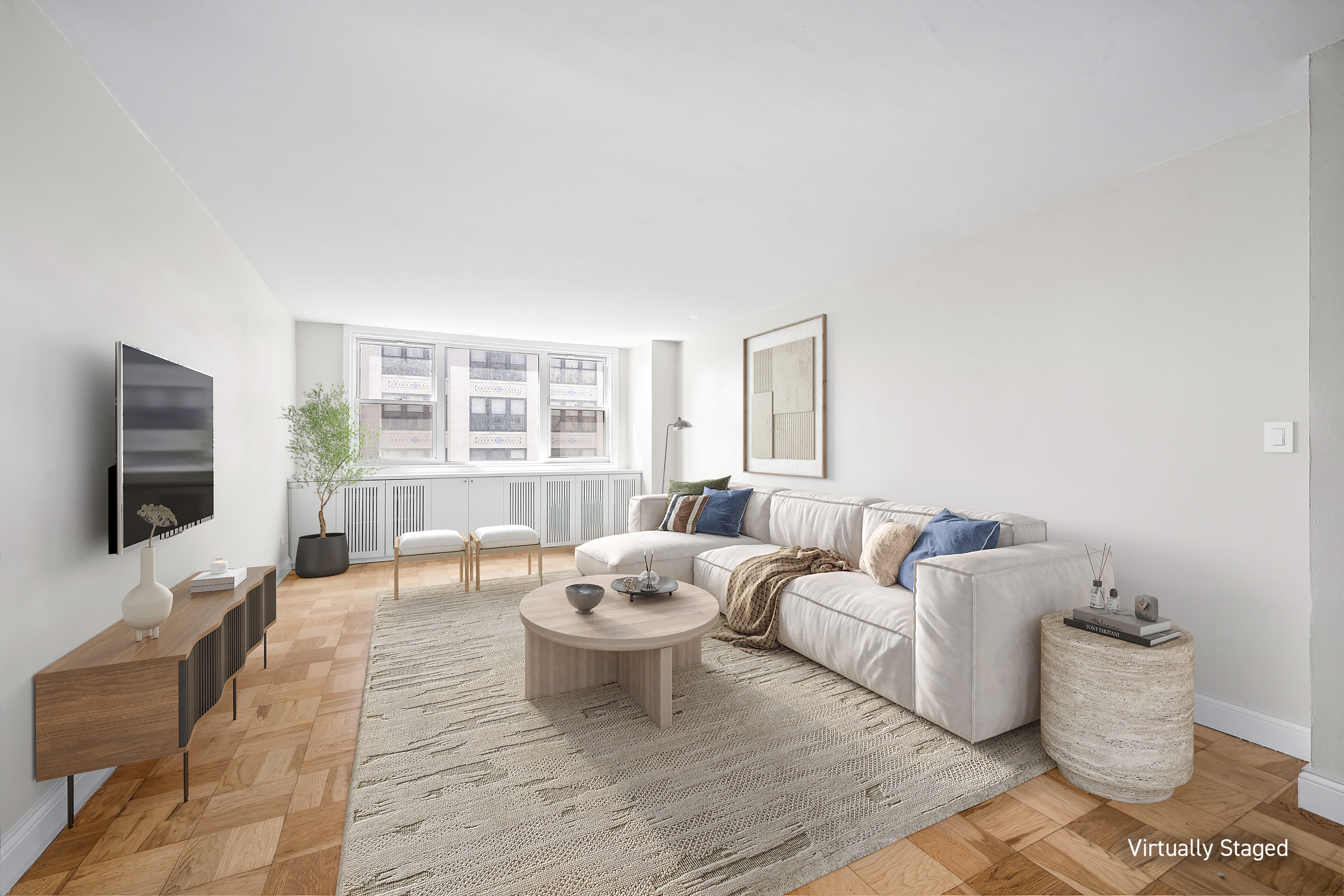 77 7th Avenue, Unit 10N Manhattan, NY 10011 - Photo 1 of 13 a living room with furniture and a flat screen tv