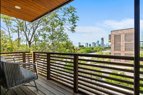 a view of a balcony with wooden floor