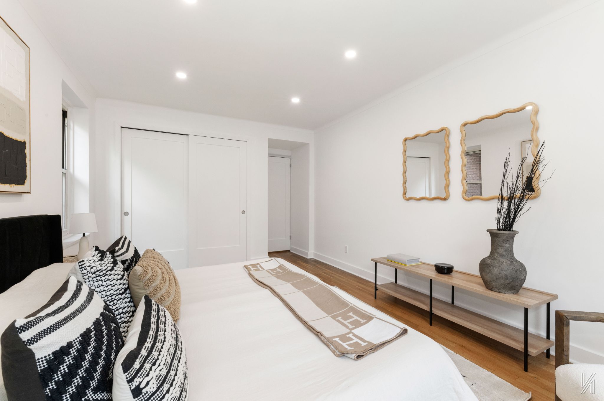 34-41 85th Street, Unit 1U Queens, NY 11372 - Photo 15 of 24 a bedroom with a bed and wooden floor