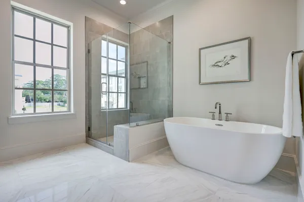 a bathroom with a bathtub and a window