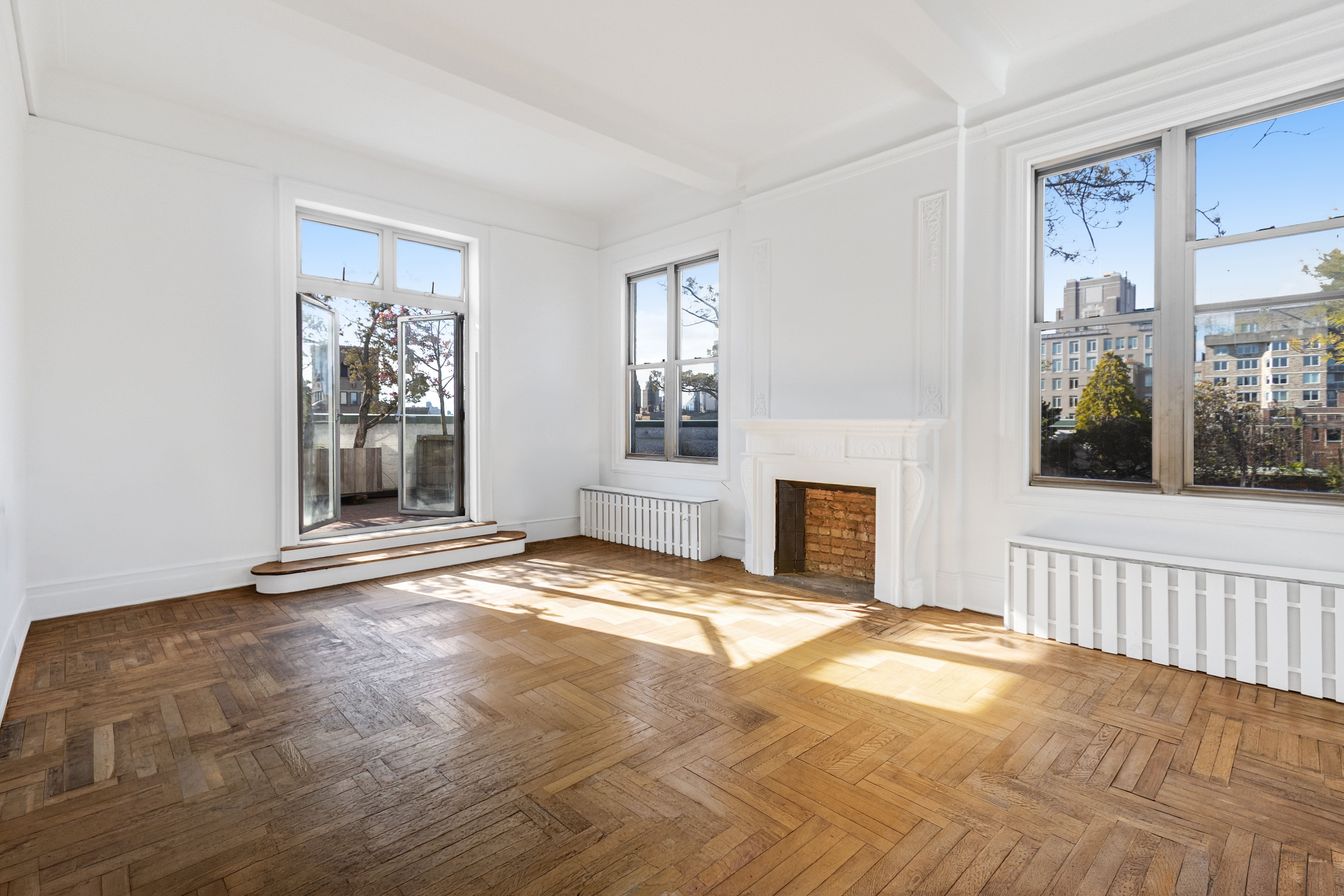 470 West End Avenue, Unit PH-G New York, NY 10024 - Photo 4 of 22 a view of a livingroom with a fireplace and windows