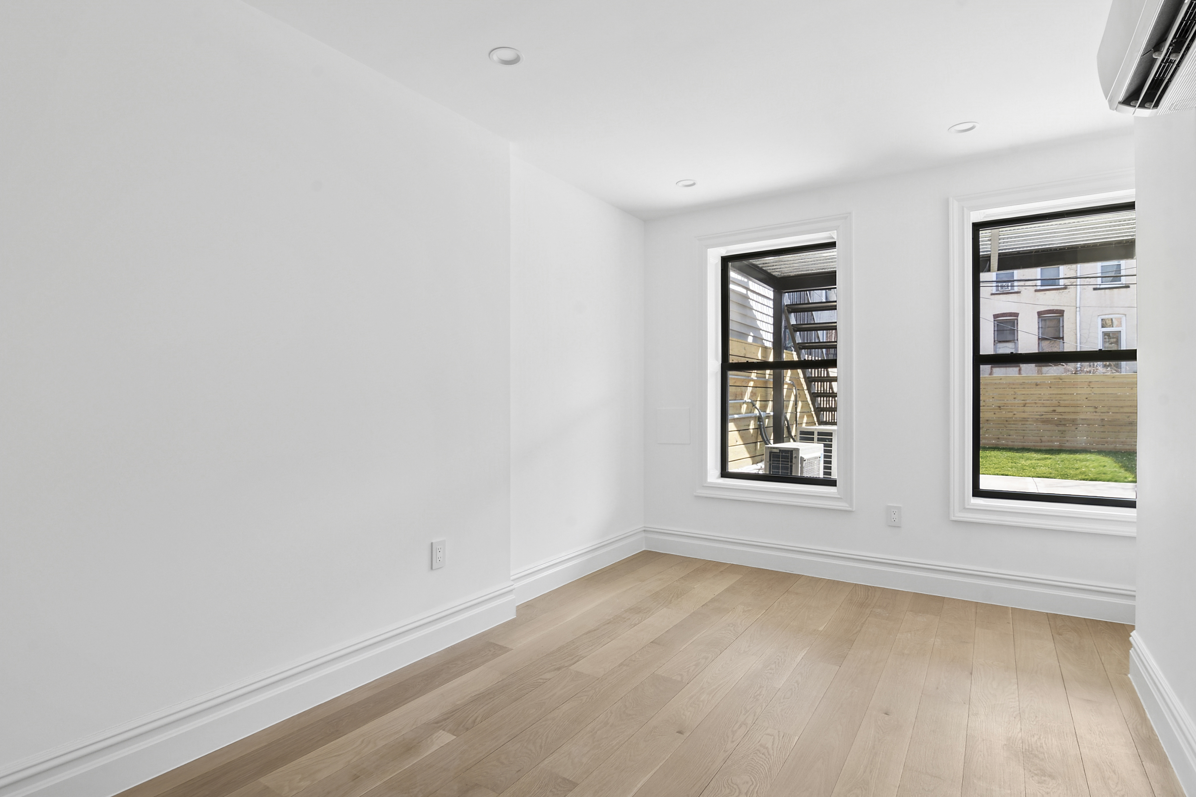 716 Decatur Street, Unit 1 Brooklyn, NY 11233 - Photo 5 of 7 an empty room with a window