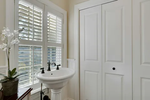 a bedroom with a bed and a flat tv screen