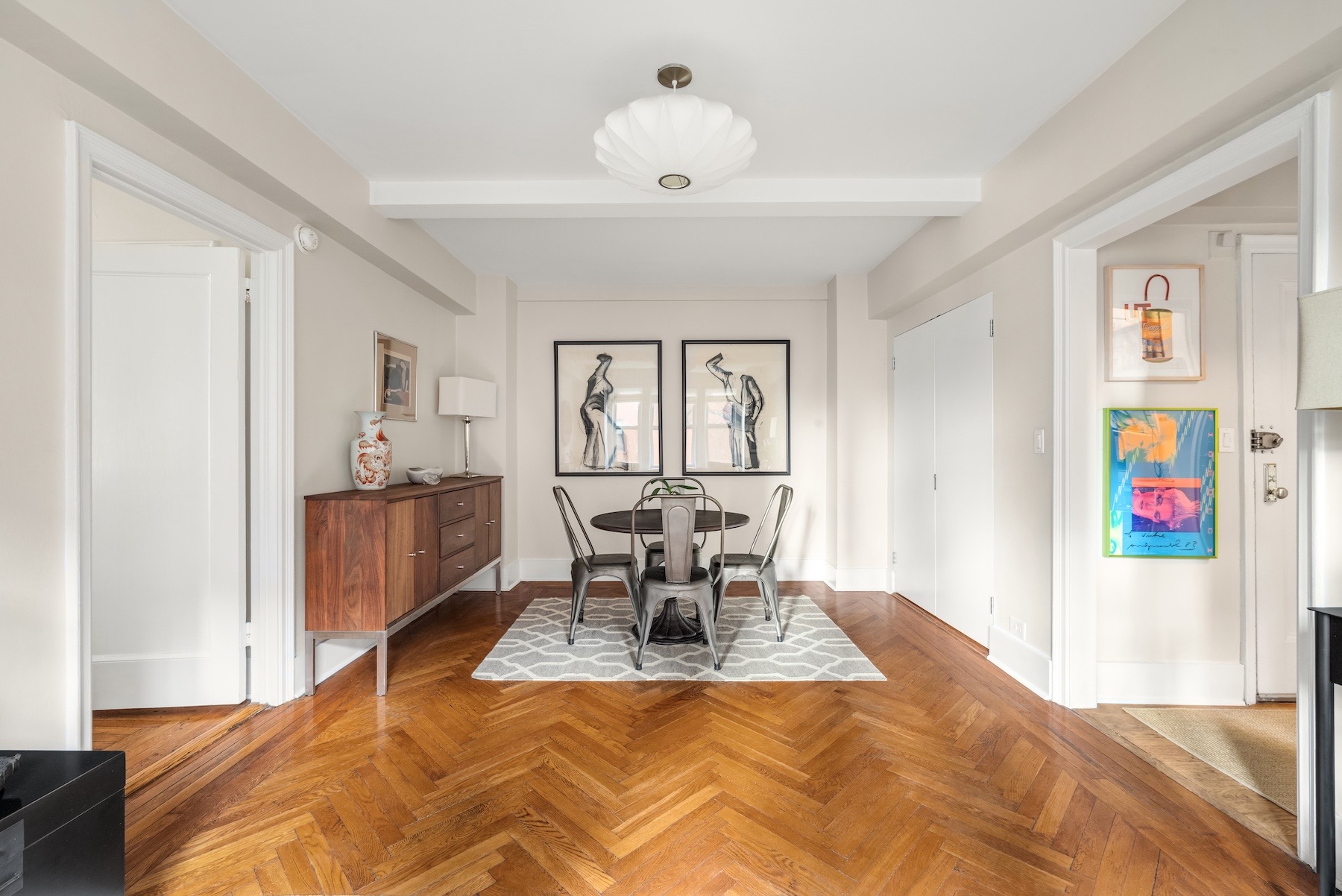 400 East 59th Street, Unit 3G Manhattan, NY 10022 - Photo 2 of 7 a bedroom with a bed and furniture