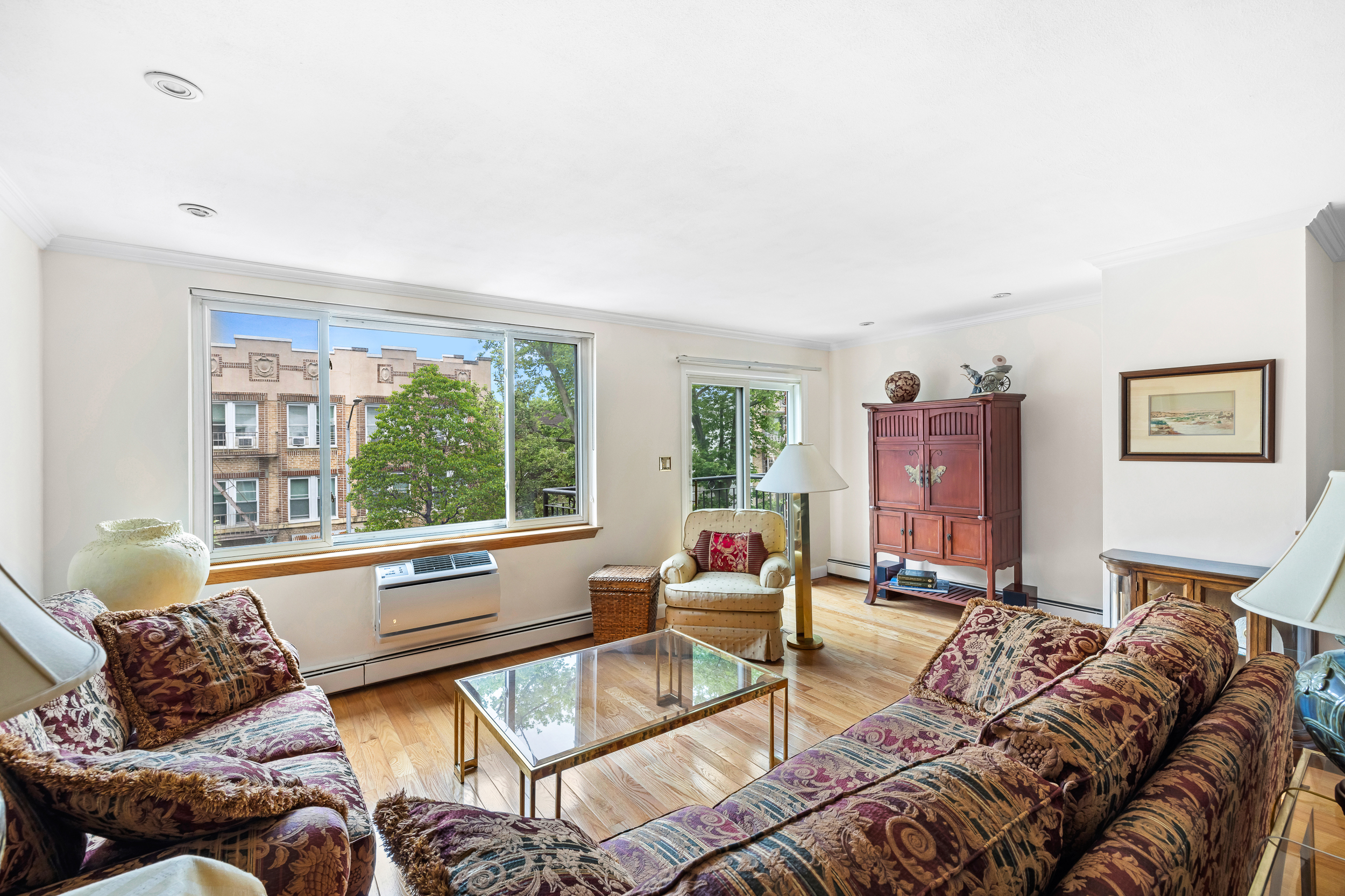 436 78th Street, Unit 5 Brooklyn, NY 11209 - Photo 2 of 10 a living room with furniture and a window