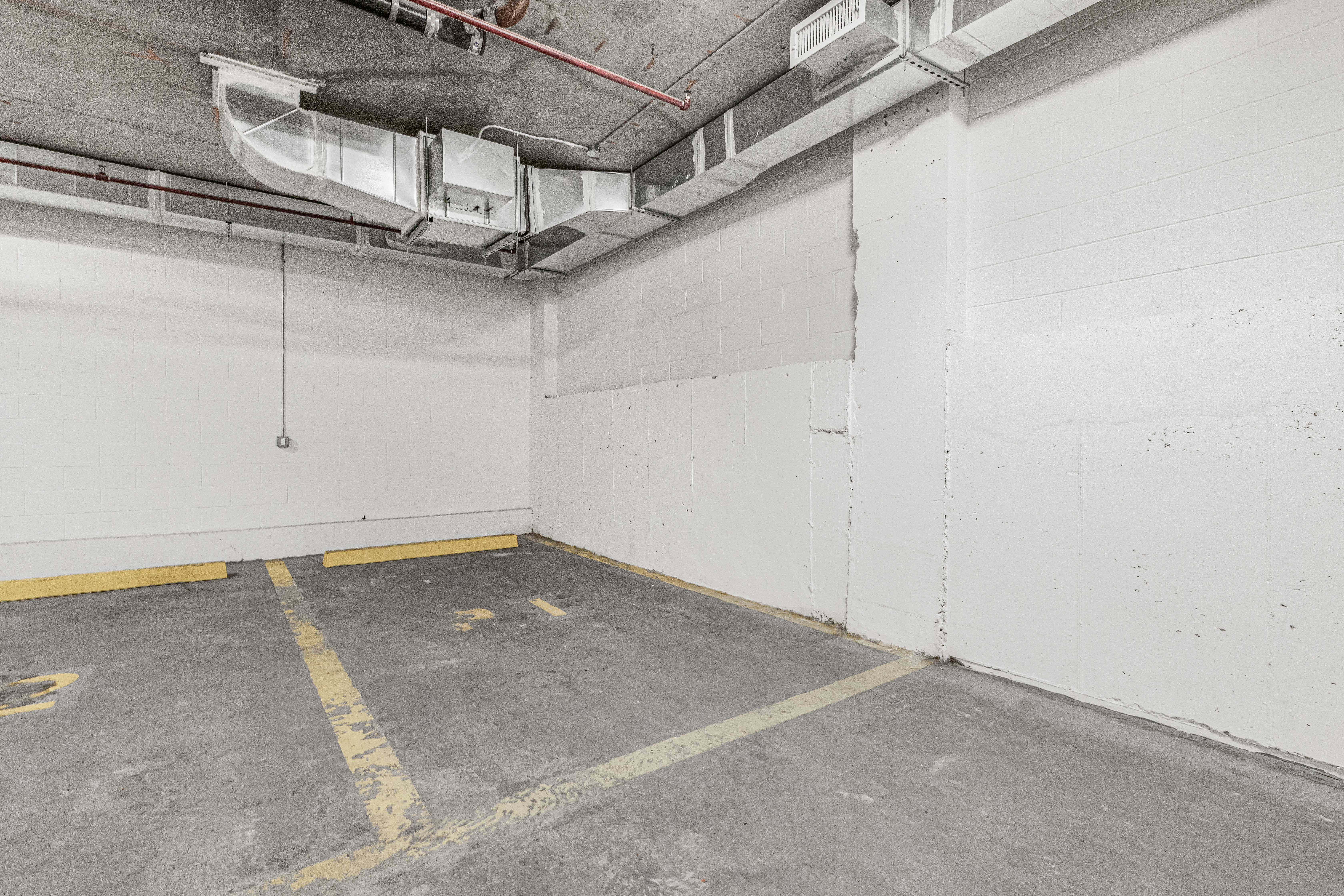 42-50 27th Street, Unit 9C Queens, NY 11101 - Photo 26 of 32 a view of a room with racks on the wall